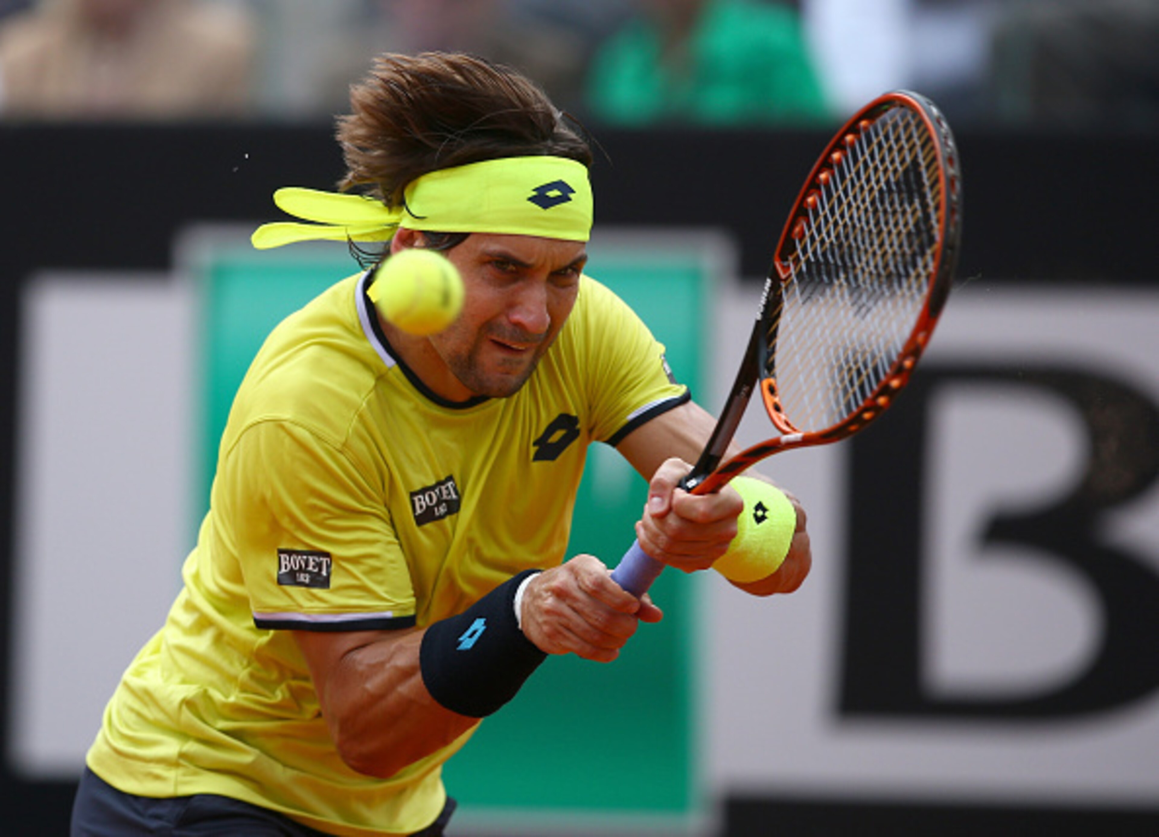 David Ferrer hits a backhand volley during a match at the 2015 Italian Open.