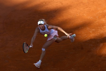 Caroline Wozniacki sprints to the ball during a match against Victoria Azarenka at the 2015 Italian Open.