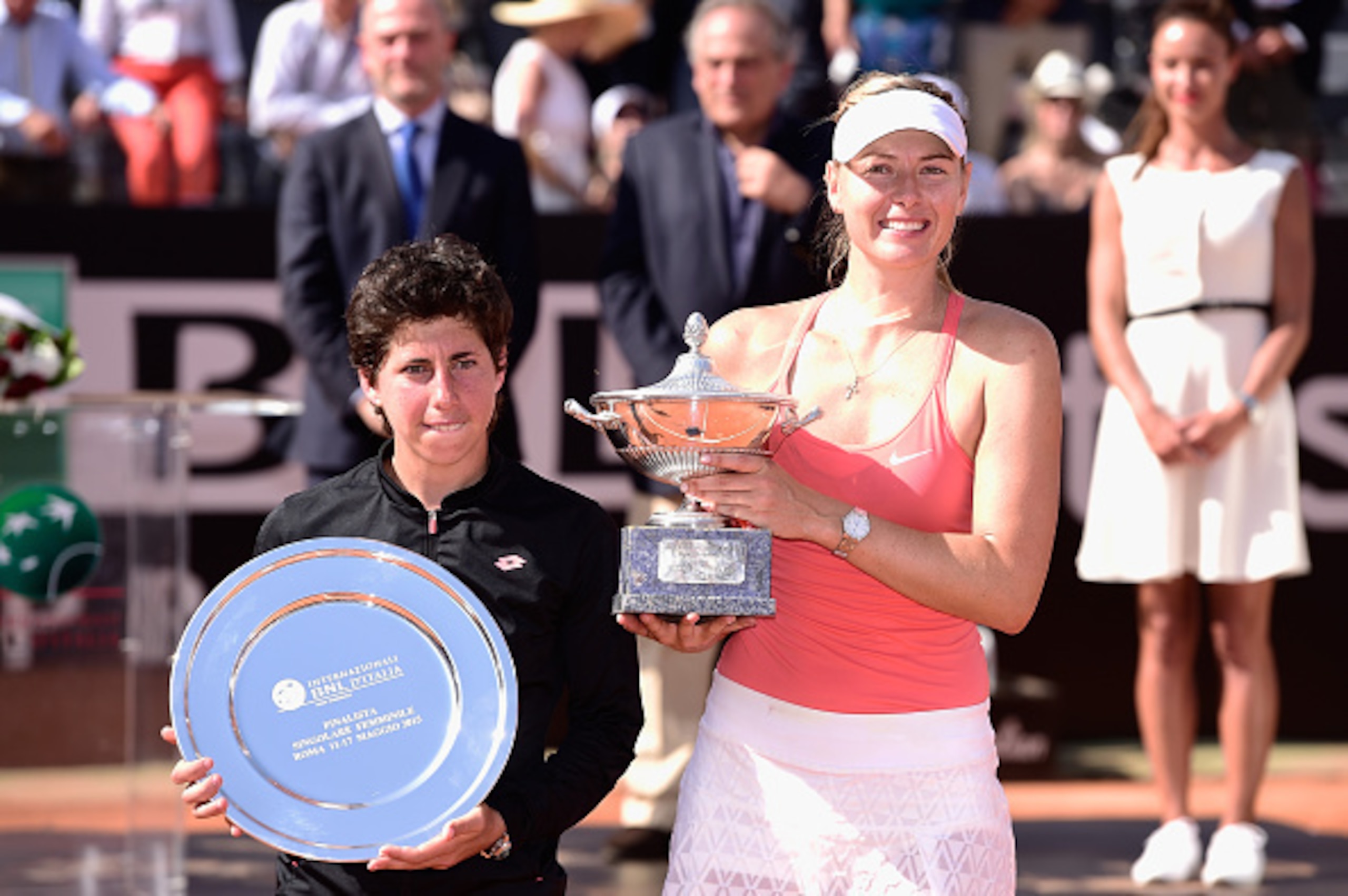 Carla Suarez Navarro and Maria Sharapova pose during trophy ceremony of 2015 Italian Open.