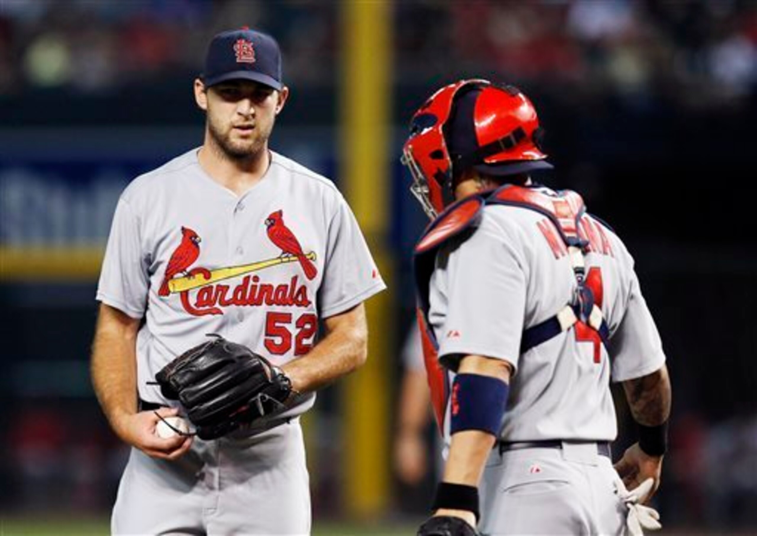 Two examples of the Cardinals' consistency: Youngster Michael Wacha and veteran Yadier Molina.