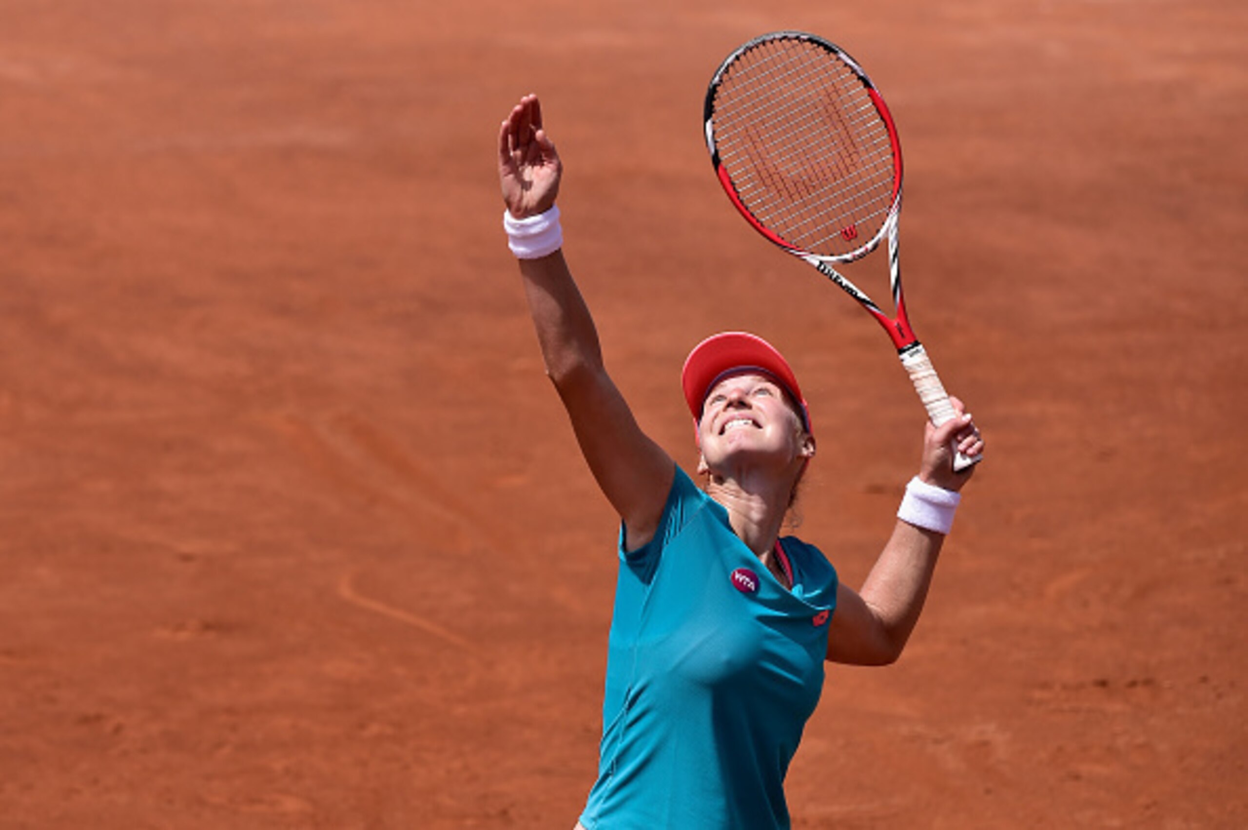 Ekaterina Makarova hits an overhead shot during a match at the Italian Open.
