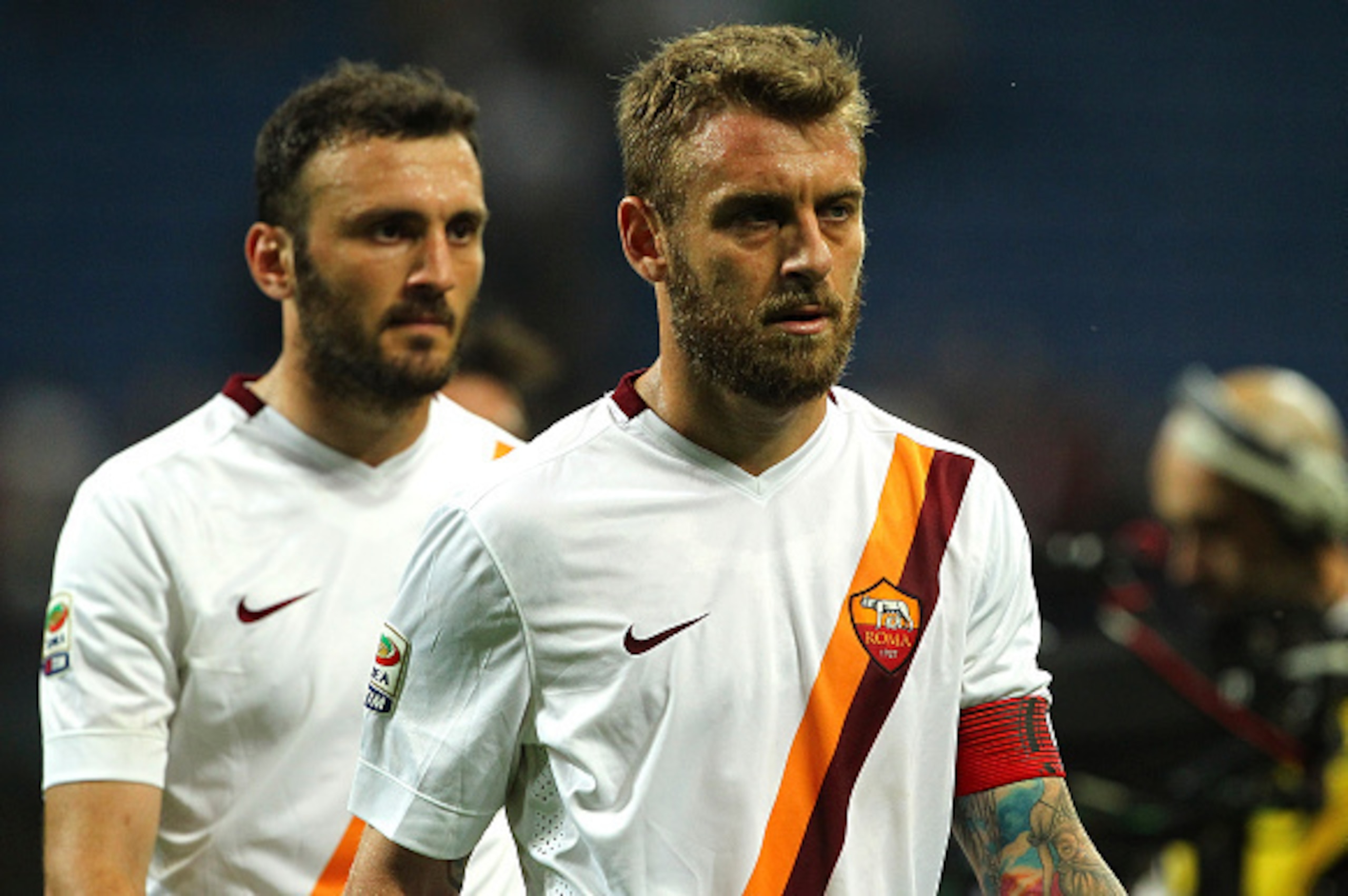 Dejected Roma players head off the field after a shock loss to AC Milan.