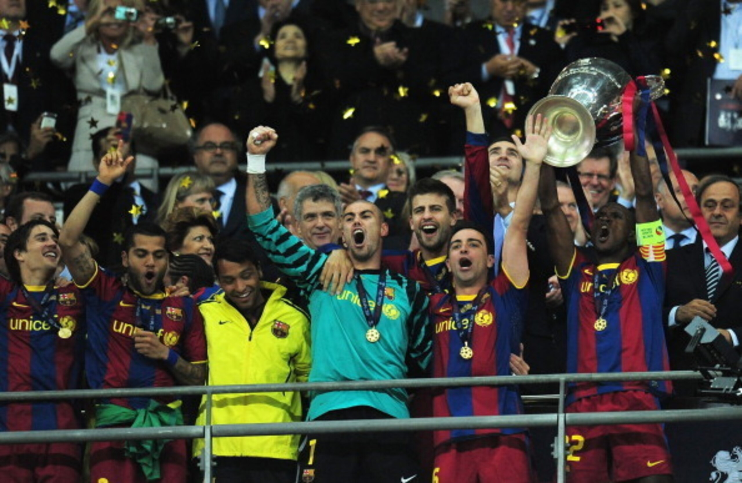 The iconic moment when Eric Abidal hoisted the trophy aloft.