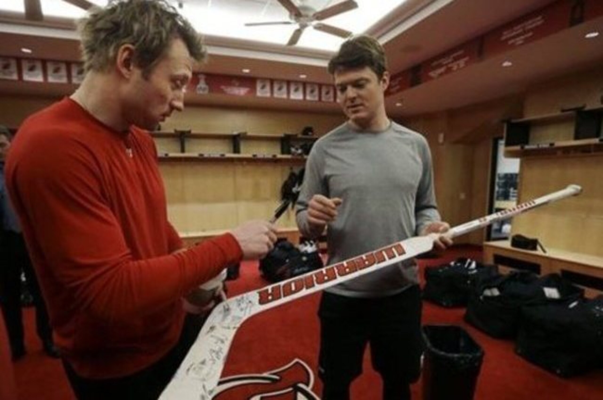 Michael Ryder signs a stick for Cory Schneider during the Devils' final day before the offseason.