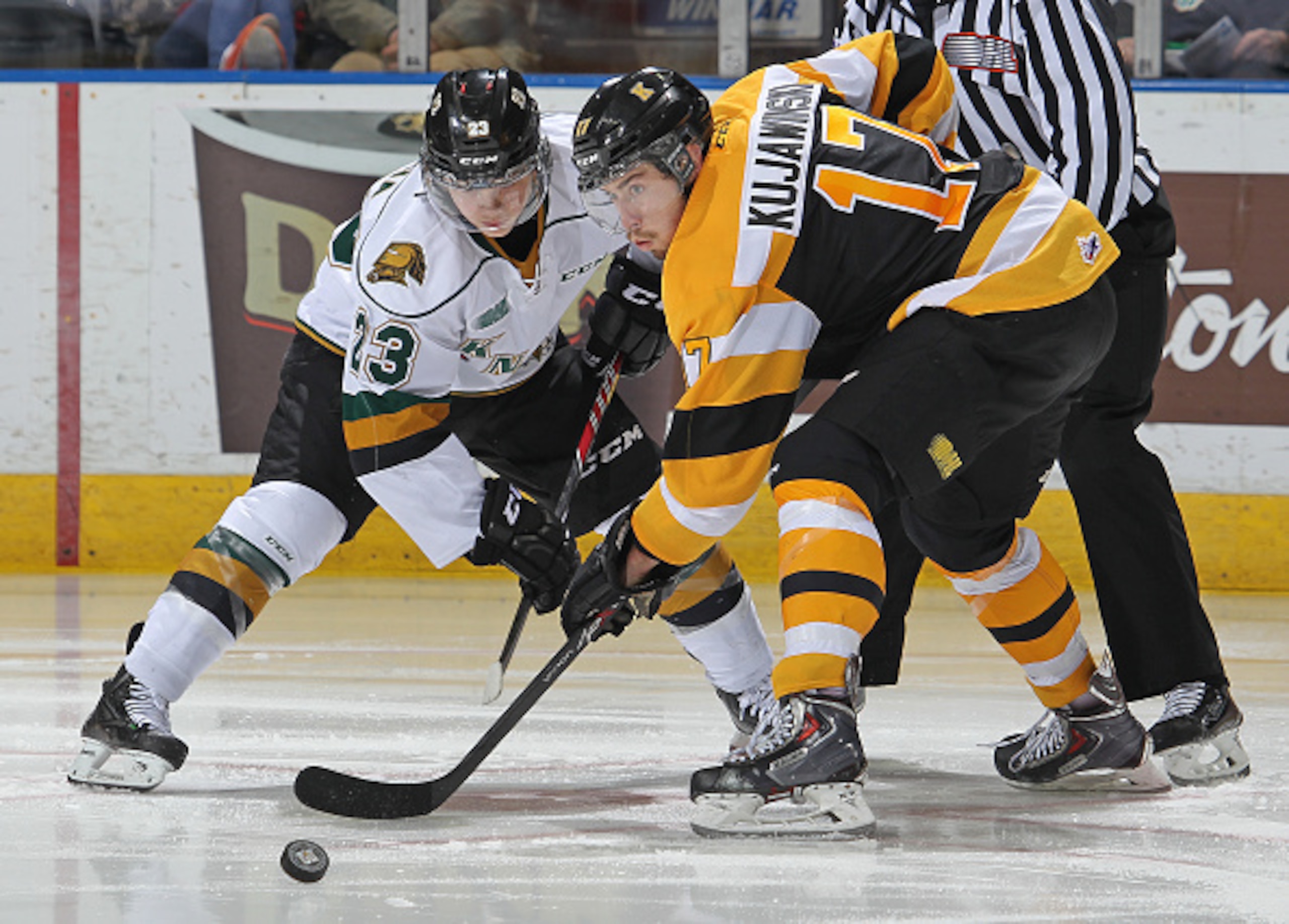 Ryan Kujawinski wins a faceoff while playing for the Kingston Frontenacs of the OHL.