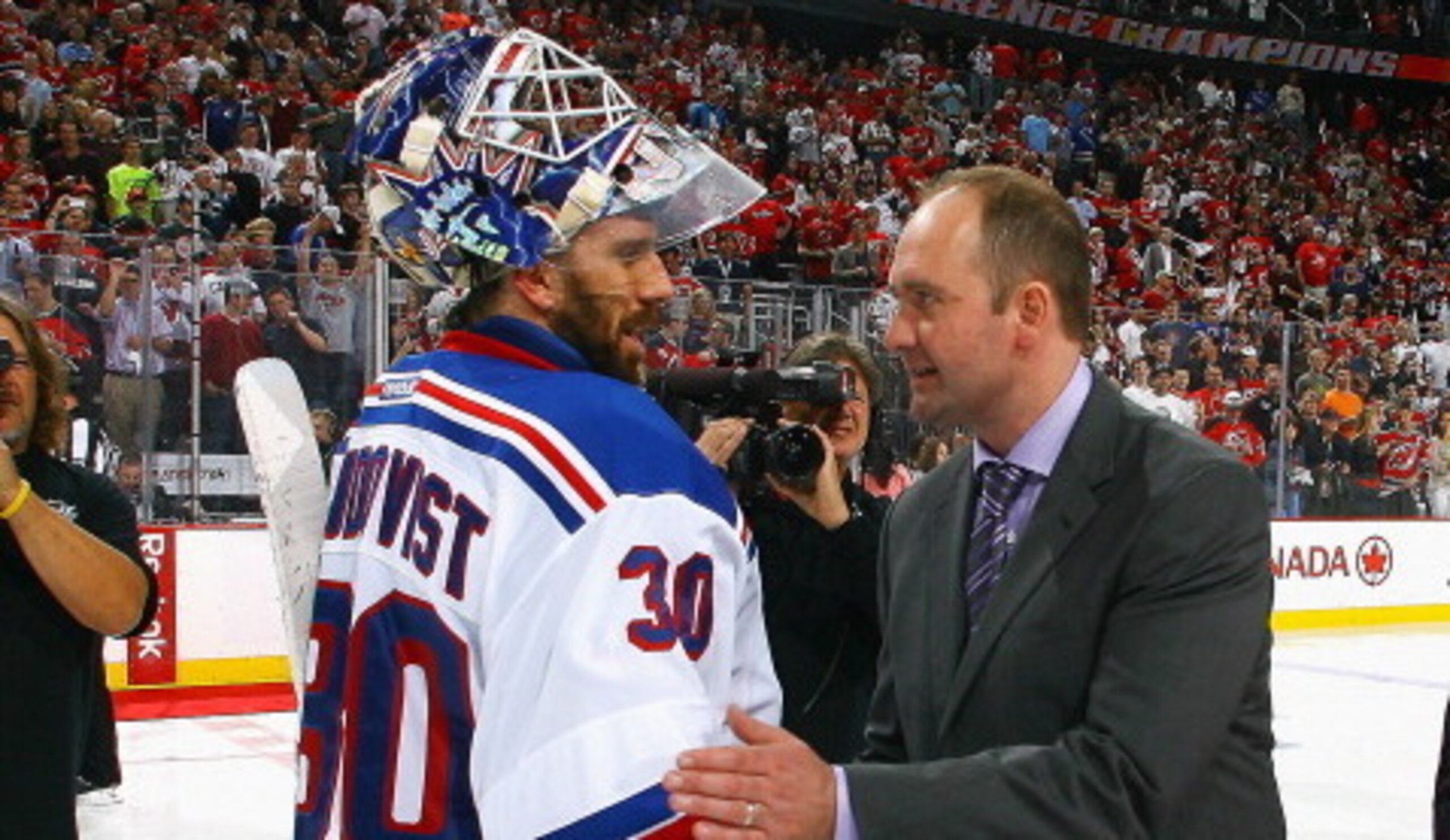 NEWARK, NJ - MAY 25:  Henrik Lundqvist #30 of the New York Rangers and head coach Peter DeBoer of the New Jersey Devils shake hands after the Devils defeated the Rangers to win the Eastern Conference Championship in game six of the Eastern Conference Fina