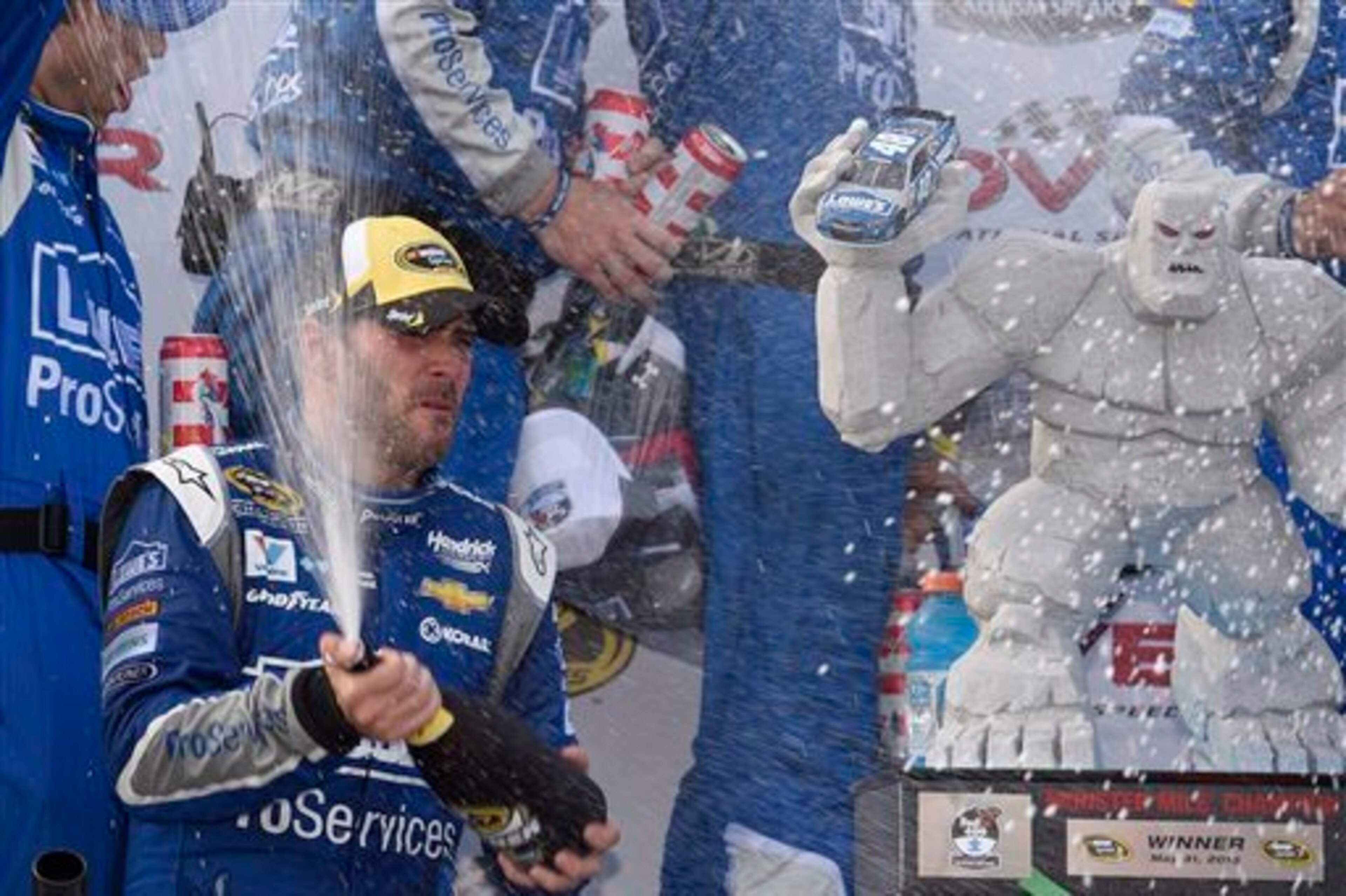 Jimmie Johnson is no stranger to post-race celebrations with Miles the Monster at Dover.
