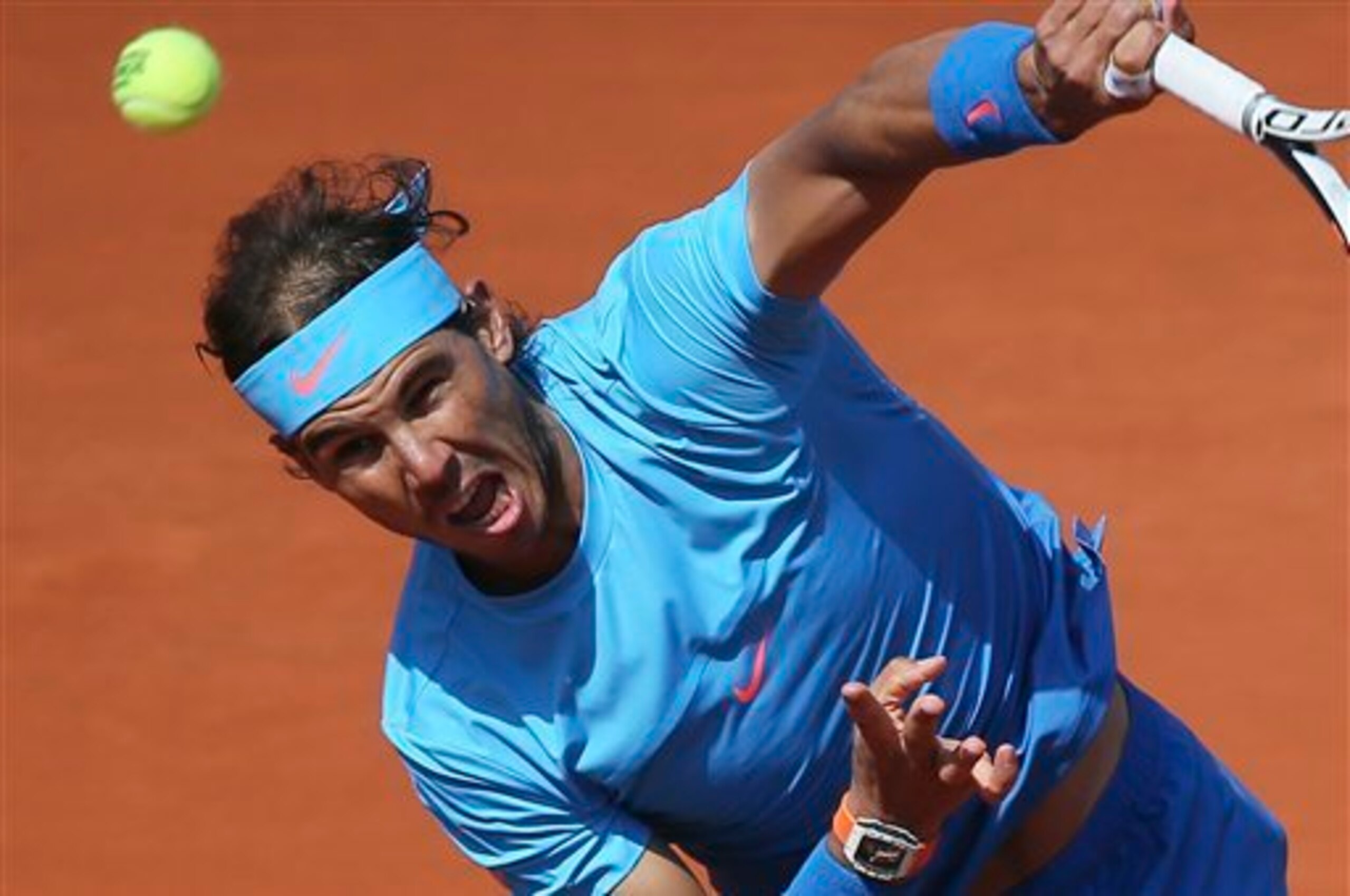Rafael Nadal serves during a match at the 2015 French Open.