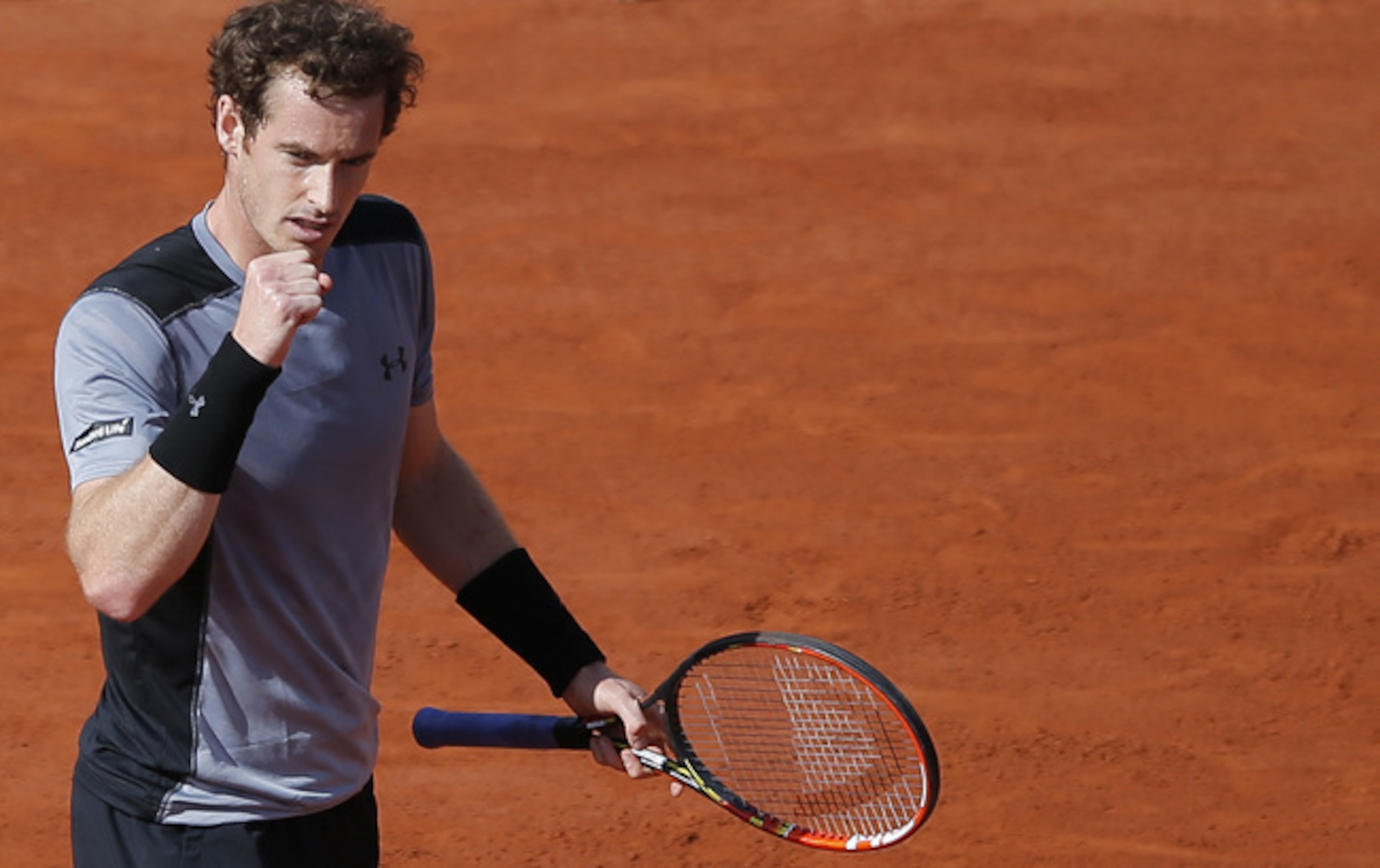Andy Murray fist-pumps during his quarterfinal match against David Ferrer at the 2015 French Open.