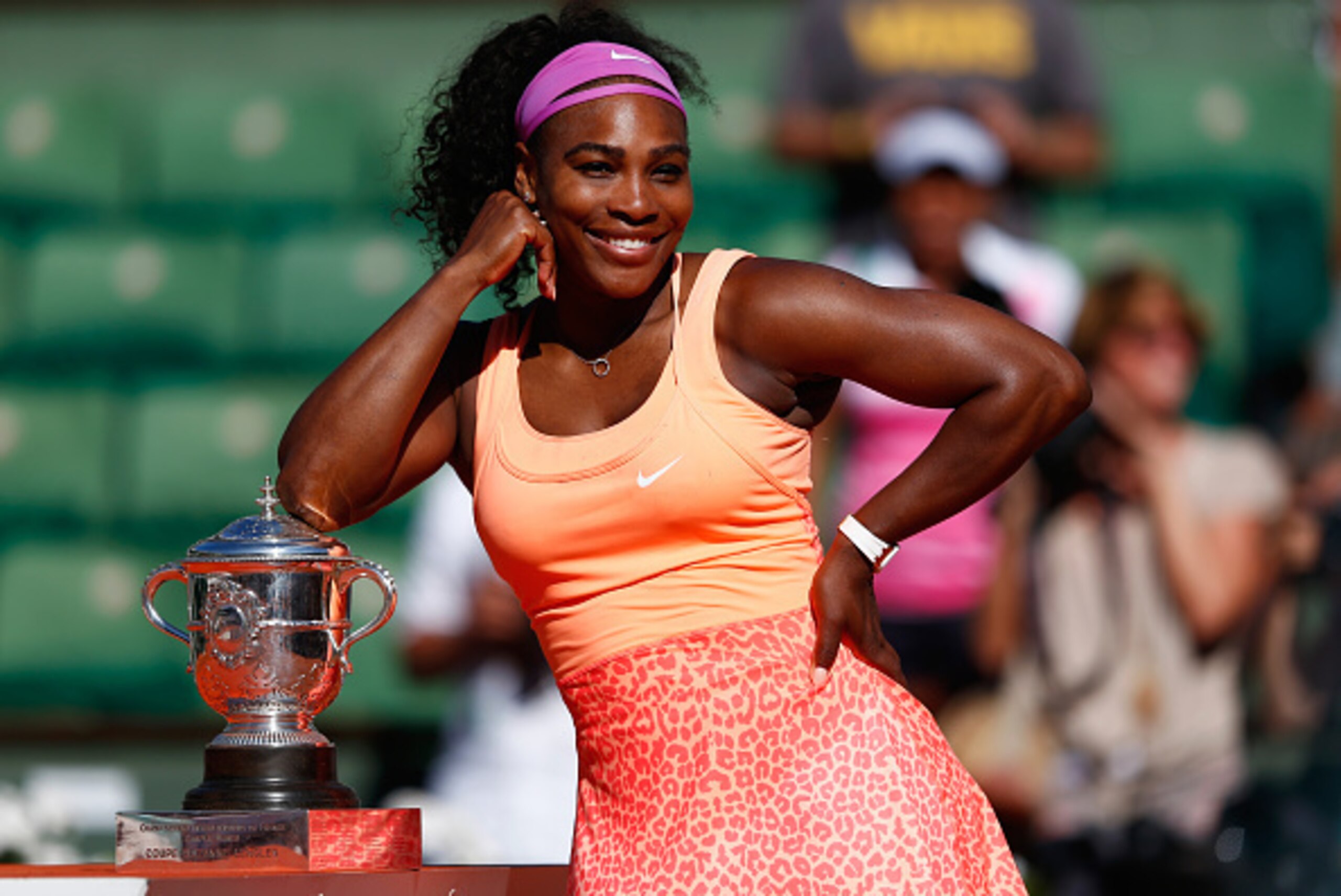 Serena Williams poses with the French Open trophy after winning her third title at Roland Garros and 20th Grand Slam.