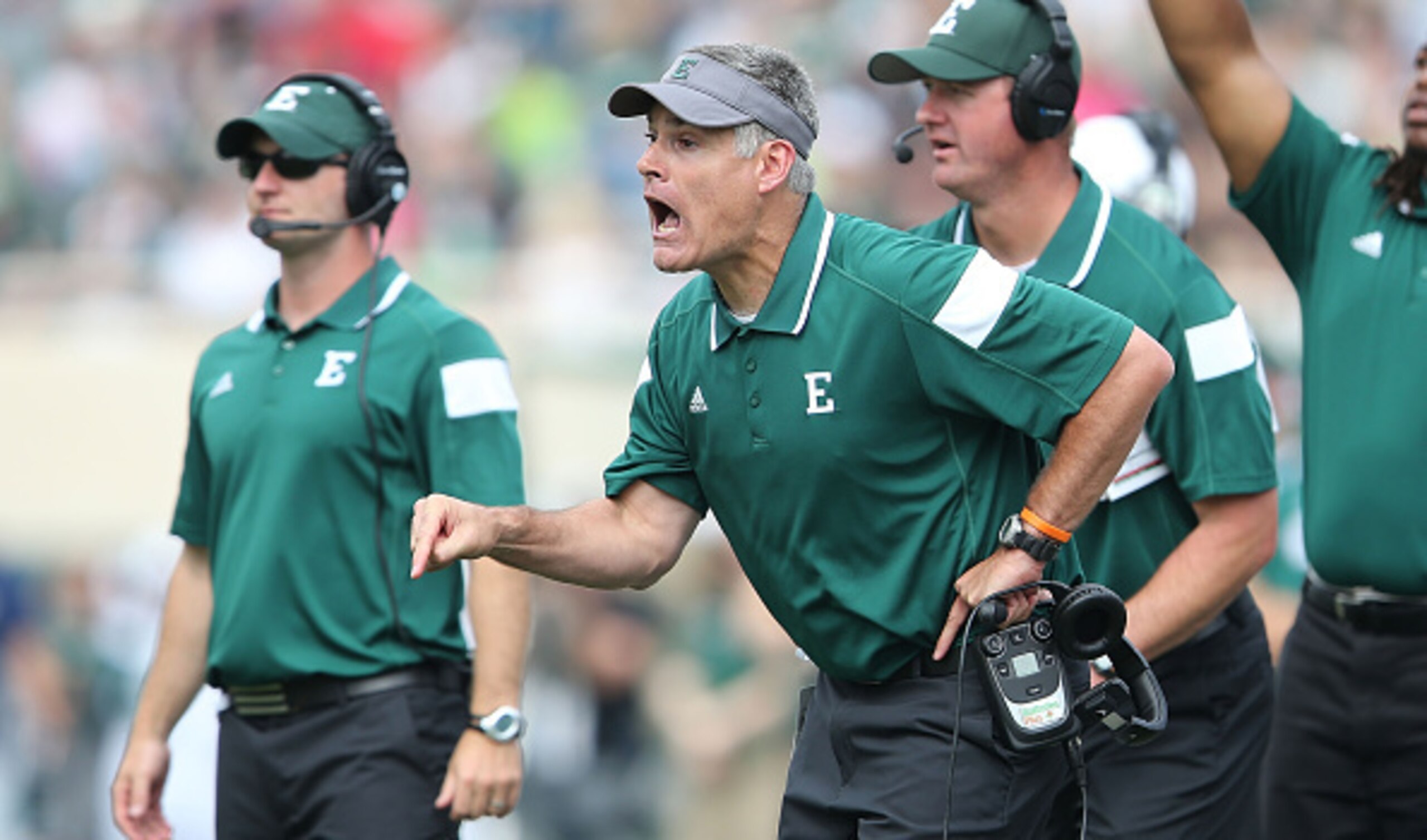 EAST LANSING, MI - SEPTEMBER 20: Eastern Michigan University Eagles head football coach Chris Creighton shouts out instructions during the third quarter of the game against the Michigan State Spartans at Spartan Stadium on September 20, 2014 in East Lansi