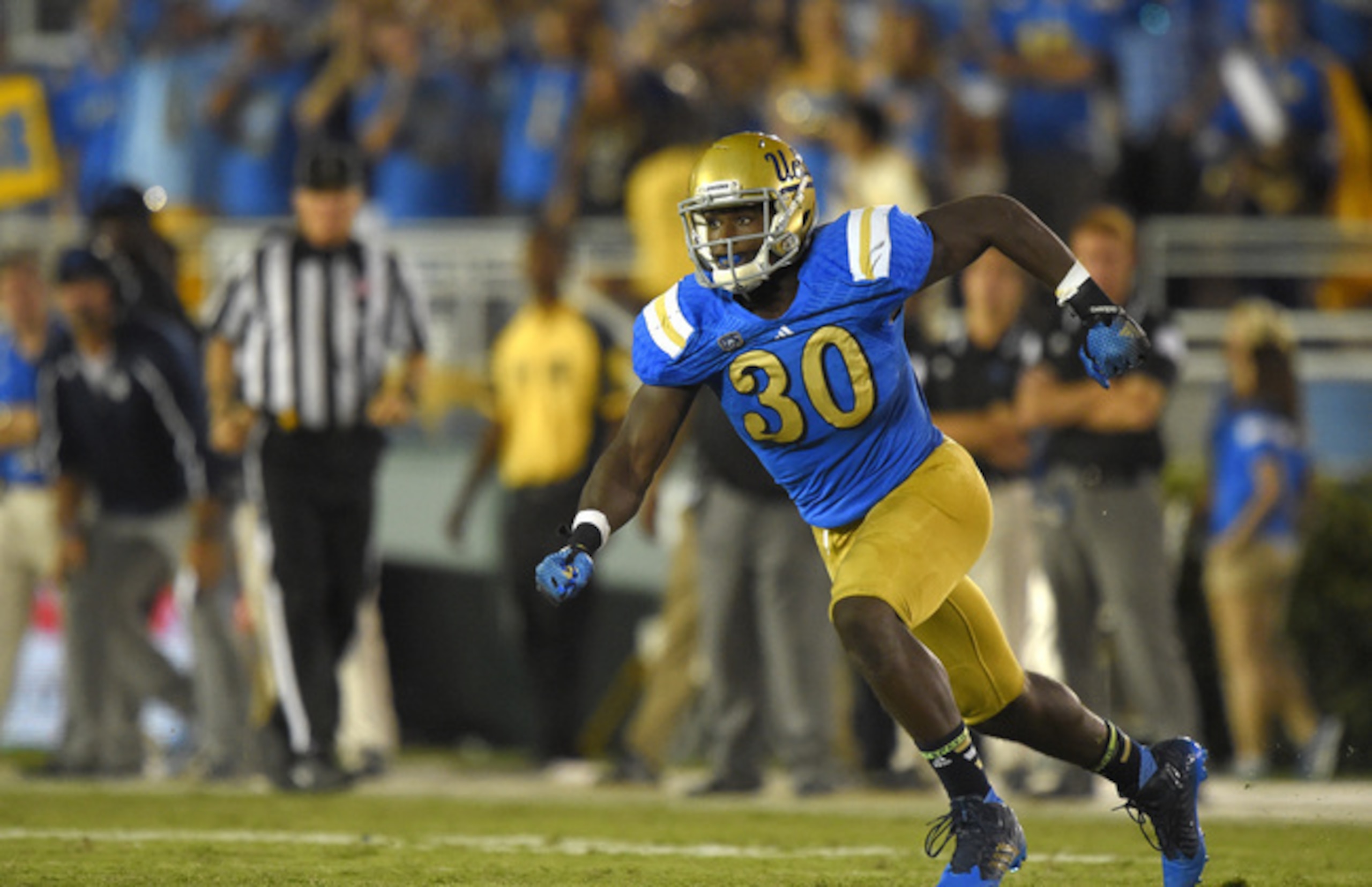 Myles Jack running after an offensive player