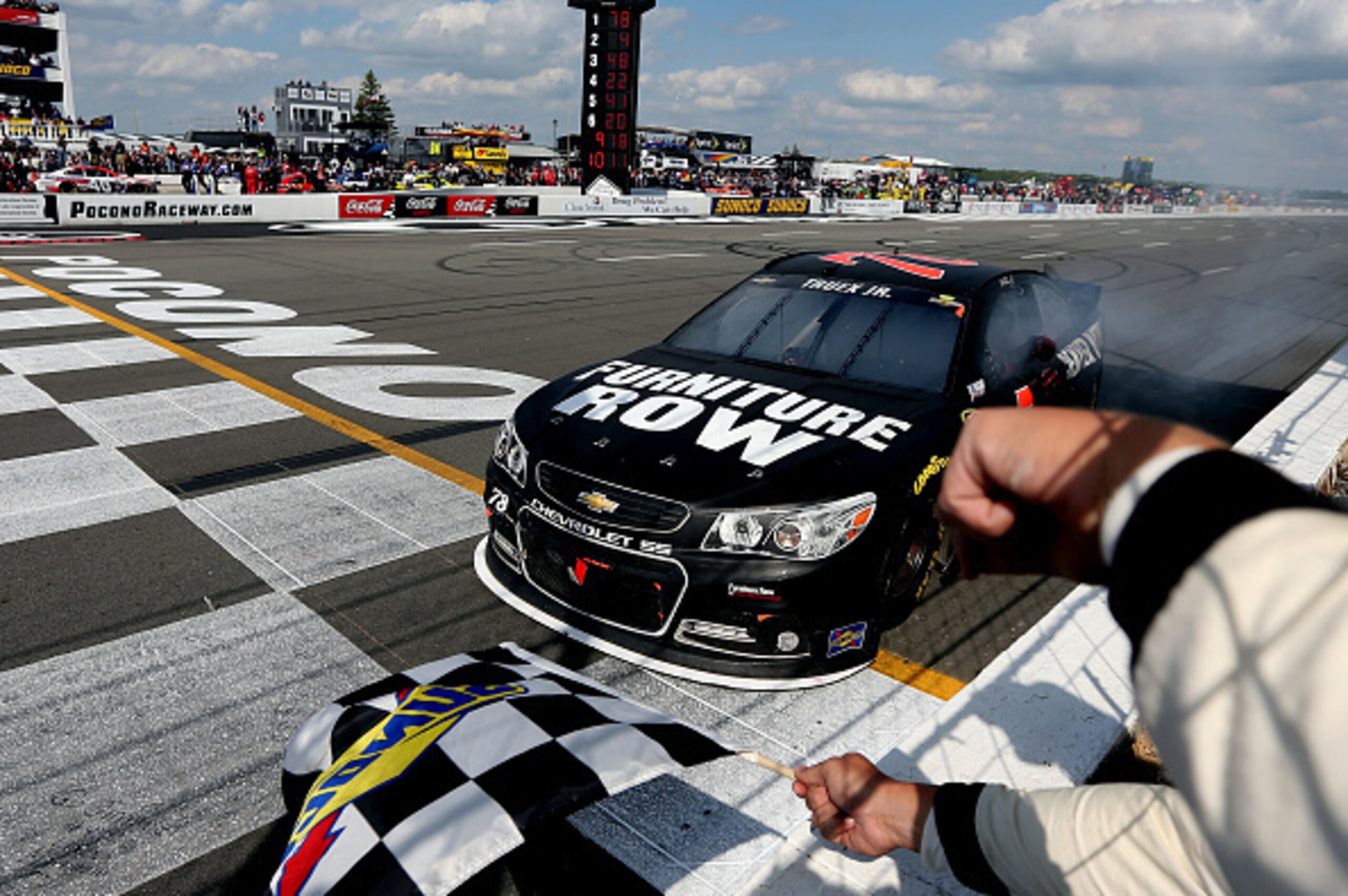 Driver Martin Truex Jr., crew chief Cole Pearn and Furniture Row Racing finally conquered all at Pocono. Driver Martin Truex Jr., crew chief Cole Pearn and Furniture Row Racing finally conquered all at Pocono.