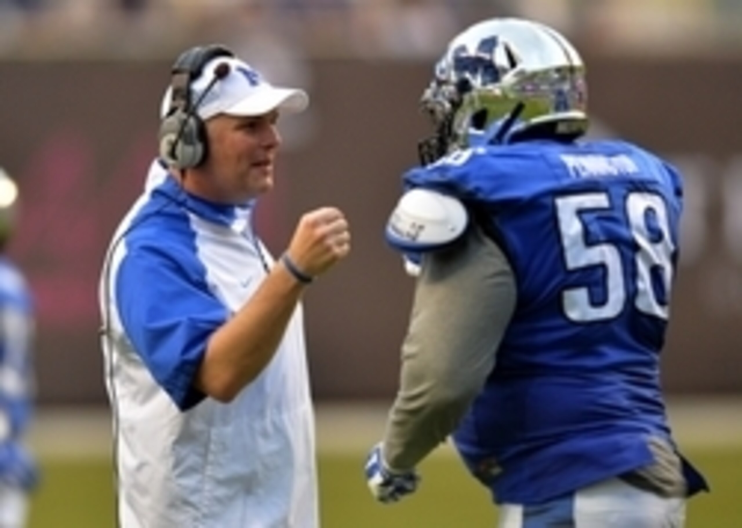 Memphis HC Justin Fuente and DL Donald Pennington