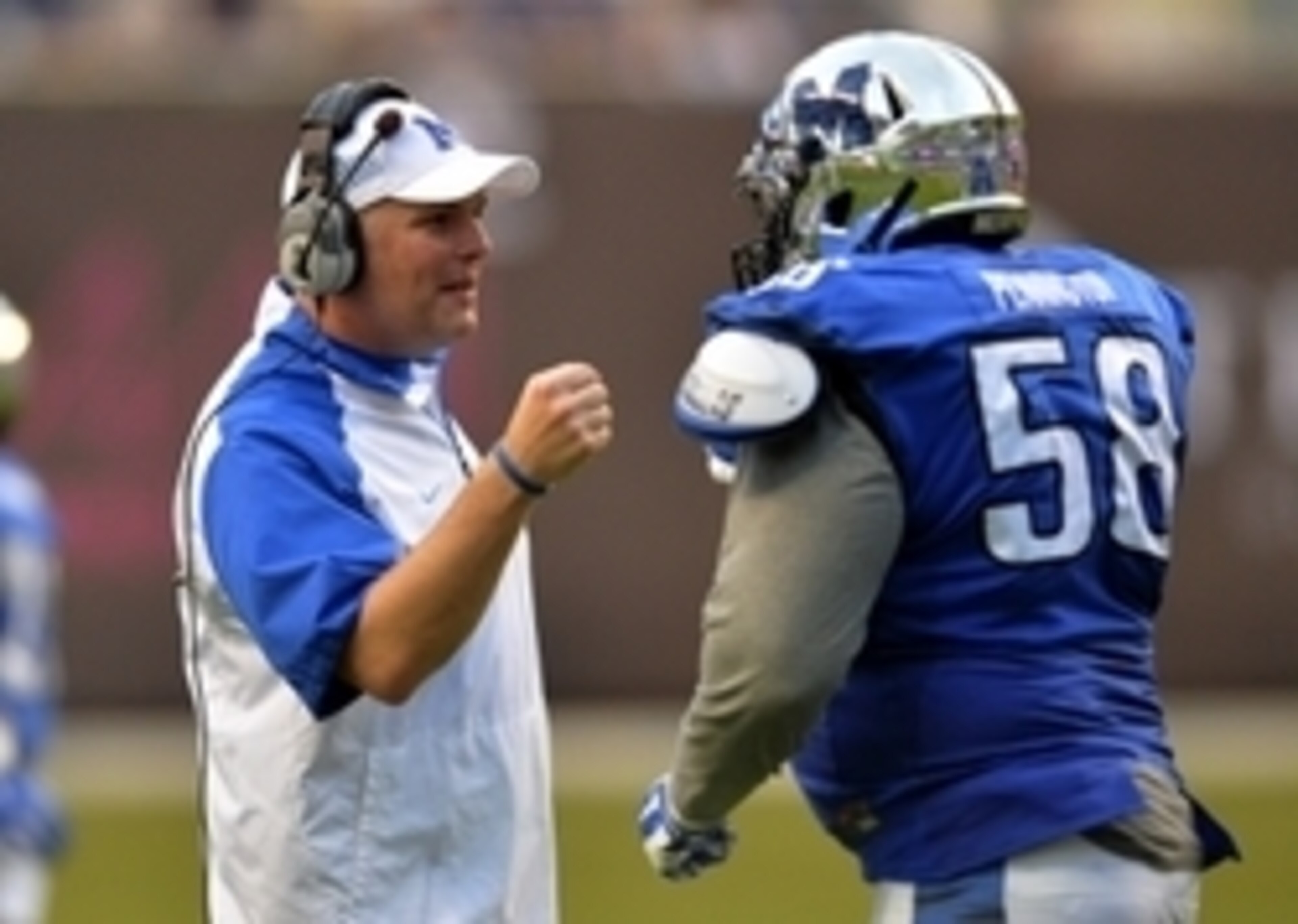 Memphis HC Justin Fuente and DL Donald Pennington Memphis HC Justin Fuente and DL Donald Pennington