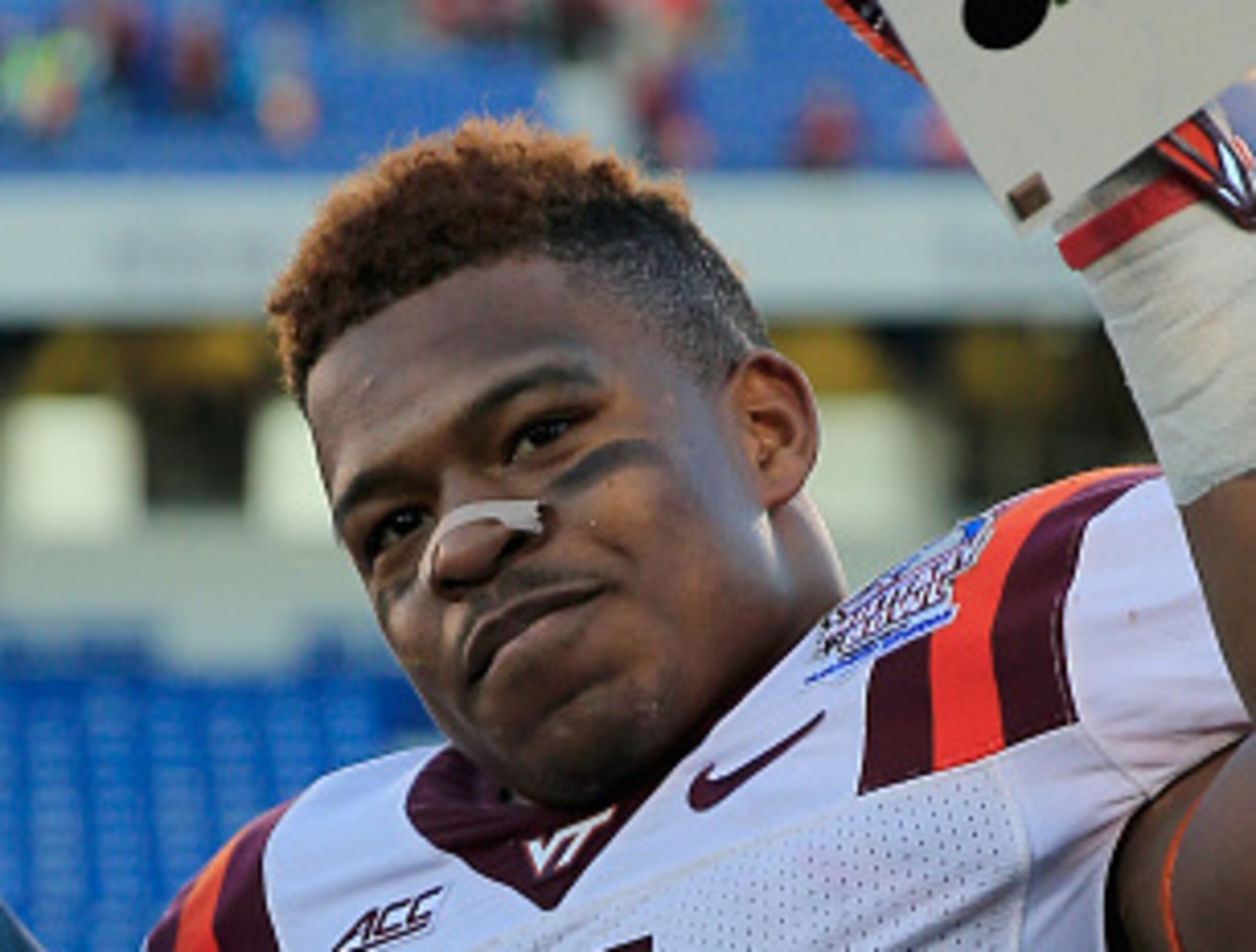 J.C. Coleman holding up his Military Bowl MVP trophy