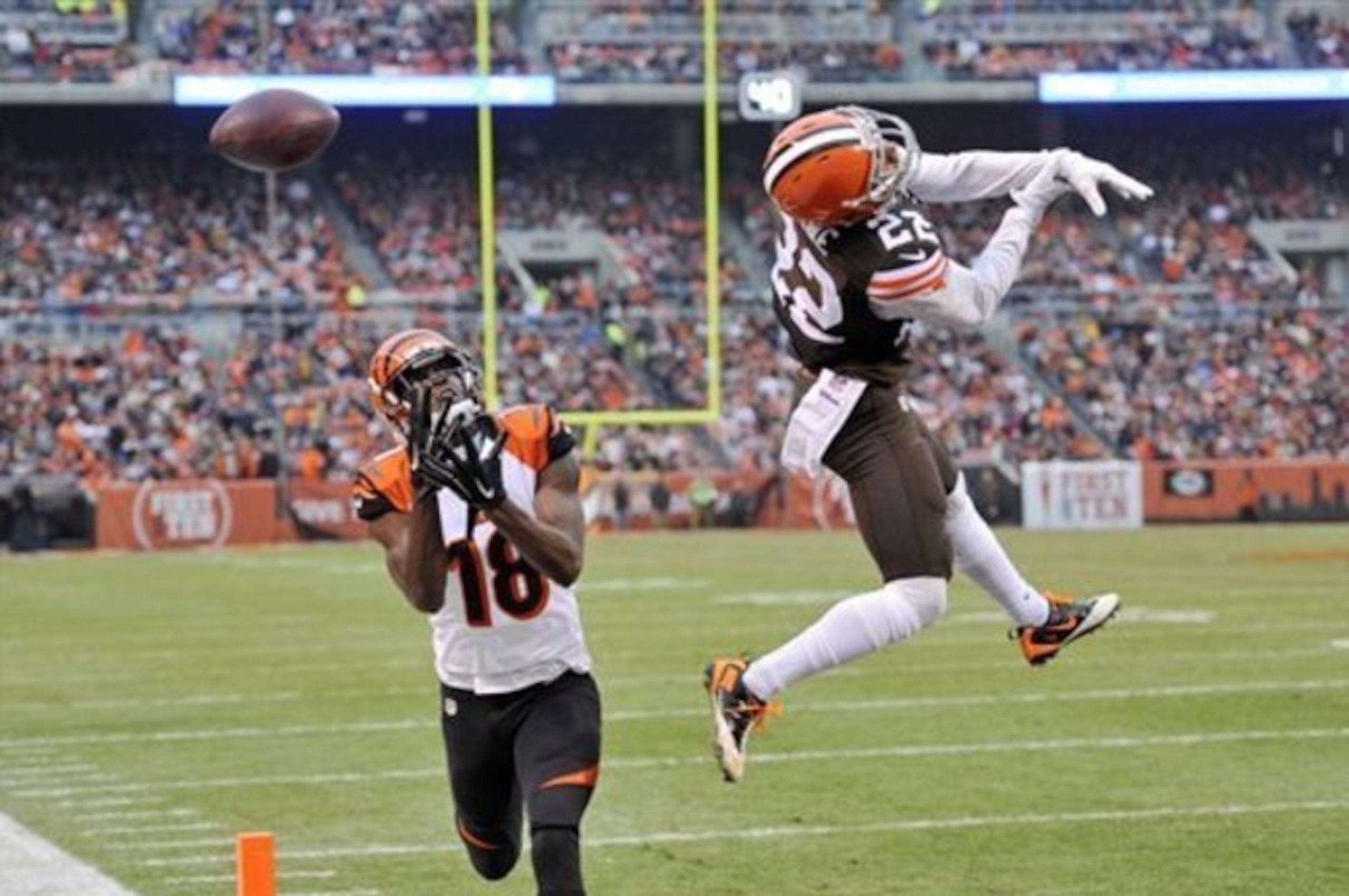 Buster Skrine (22, right) may be smaller than some wide receivers like A.J. Green (18, left), but he can still make plays on those receivers.