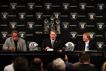 General manager Reggie McKenzie (far left), head coach Jack Del Rio (middle) and owner Mark Davis (far right)