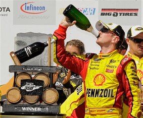 Kurt Busch was driver of the No. 22 Team Penske car when he guzzled champagne in Victory Lane at Sonoma in 2011.