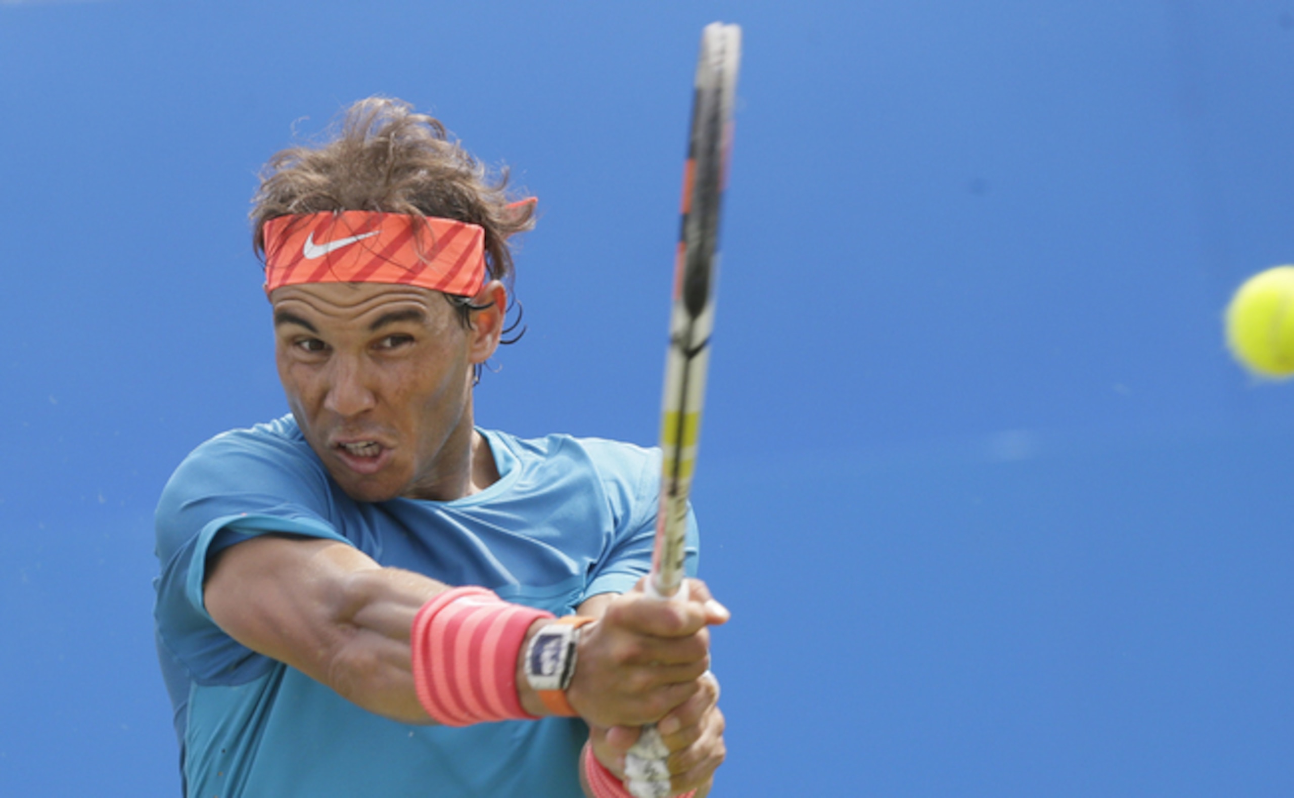 Rafael Nadal hits a backhand during a match at the 2015 Queen's Club Championships.