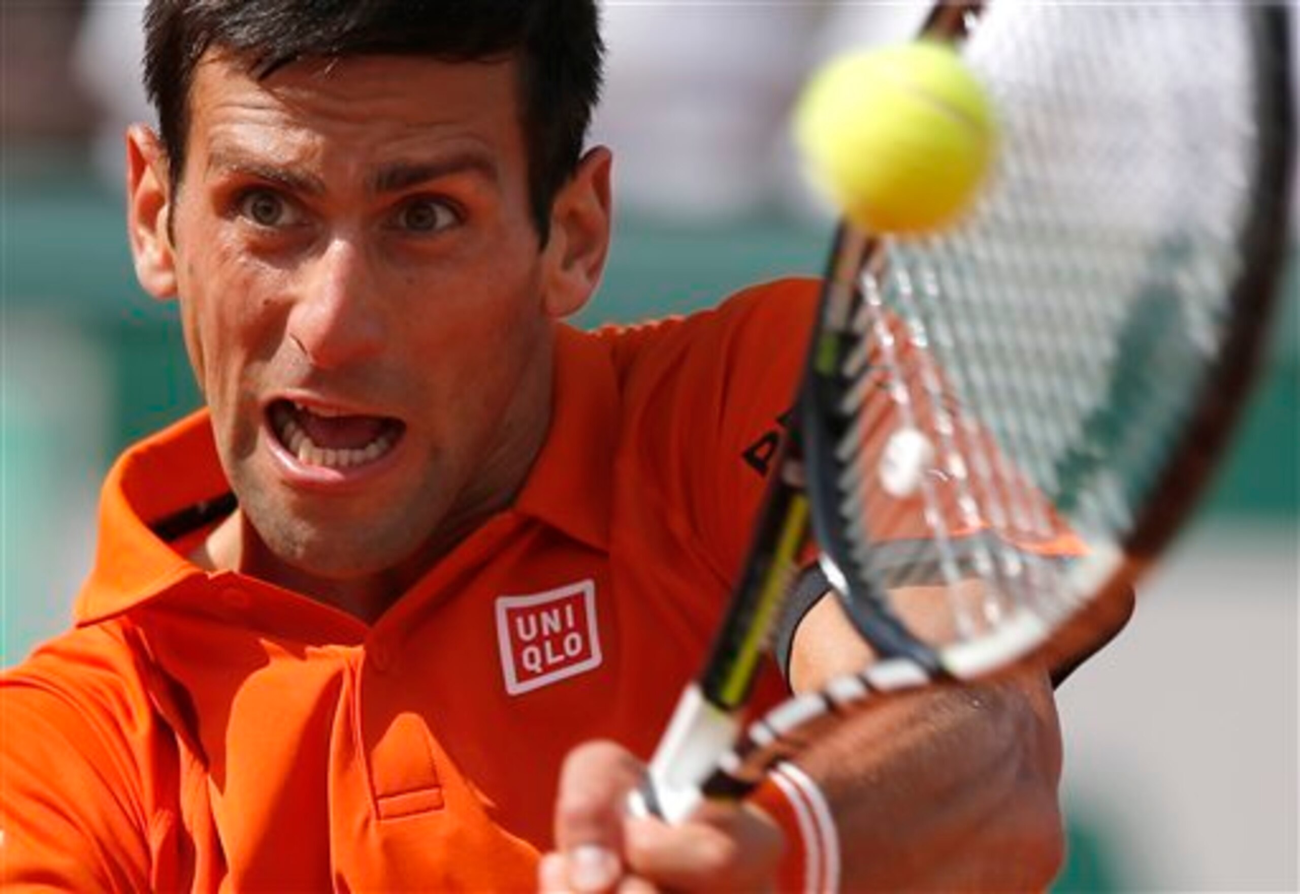 Novak Djokovic hits a backhand during the 2015 French Open final.