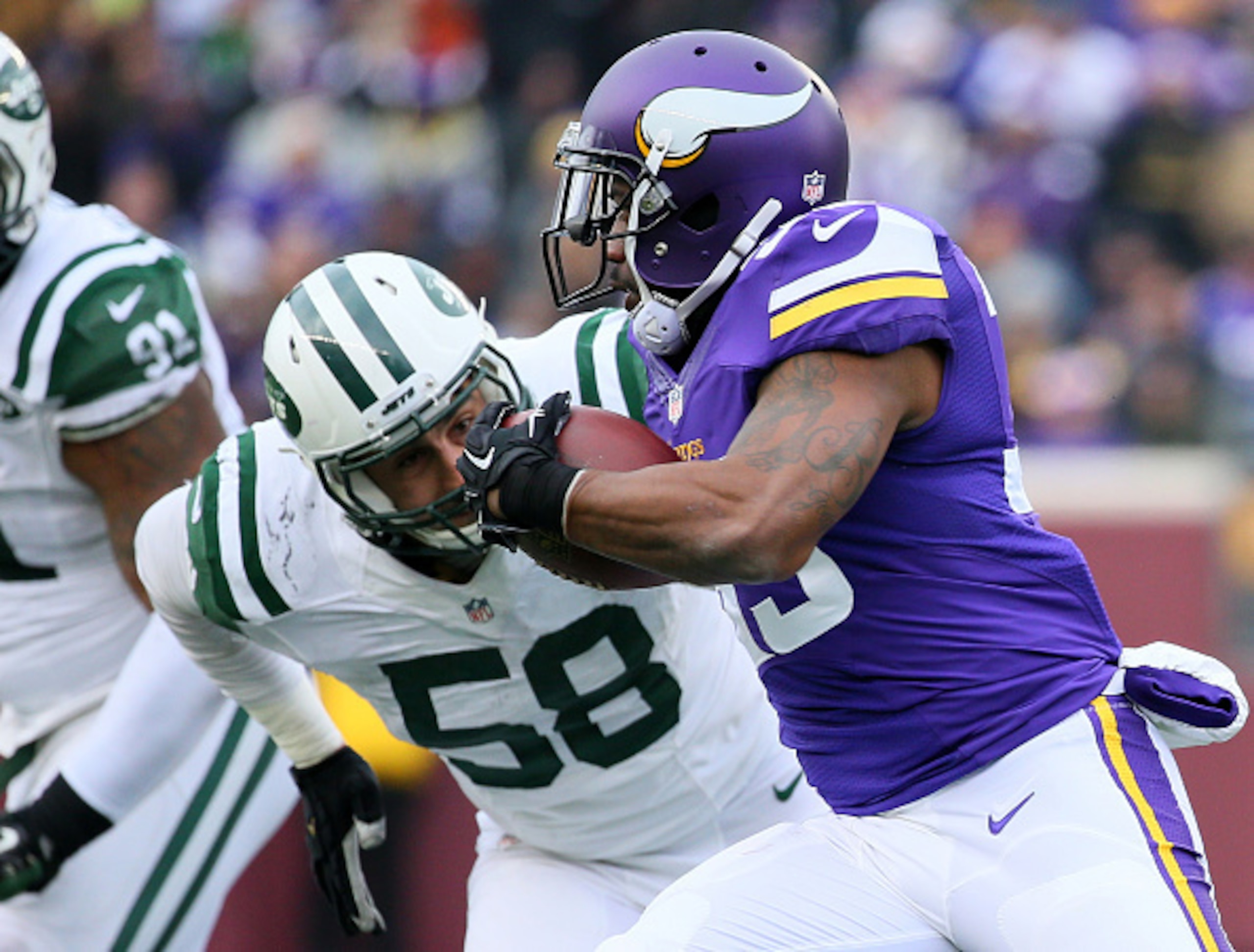 Jason Babin (58, left) could be on the outside looking in on the Jets roster this summer.