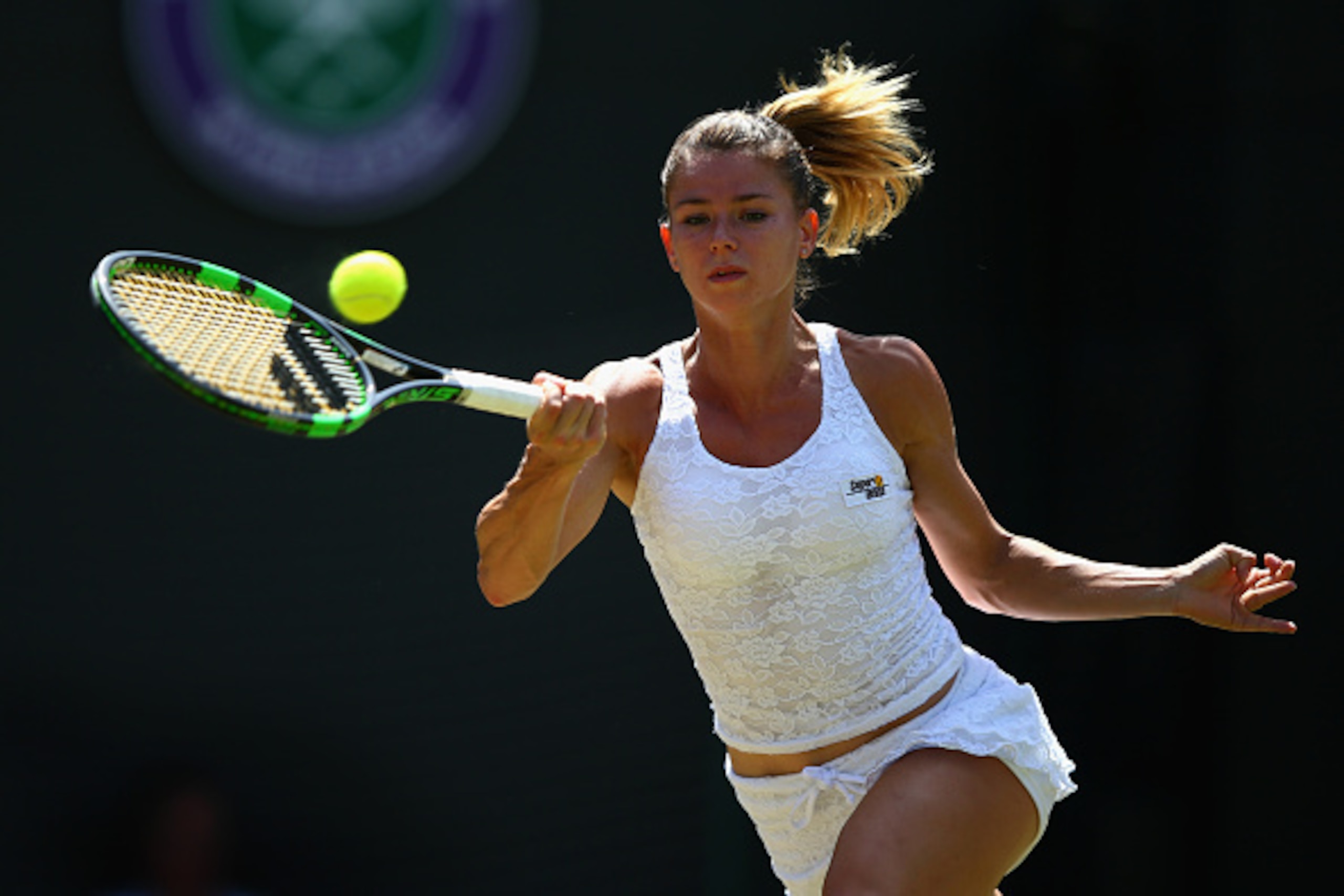 Camila Giorgi hits a forehand during a match at Wimbledon.