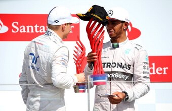 Lewis Hamilton with the offending trophy last season.
