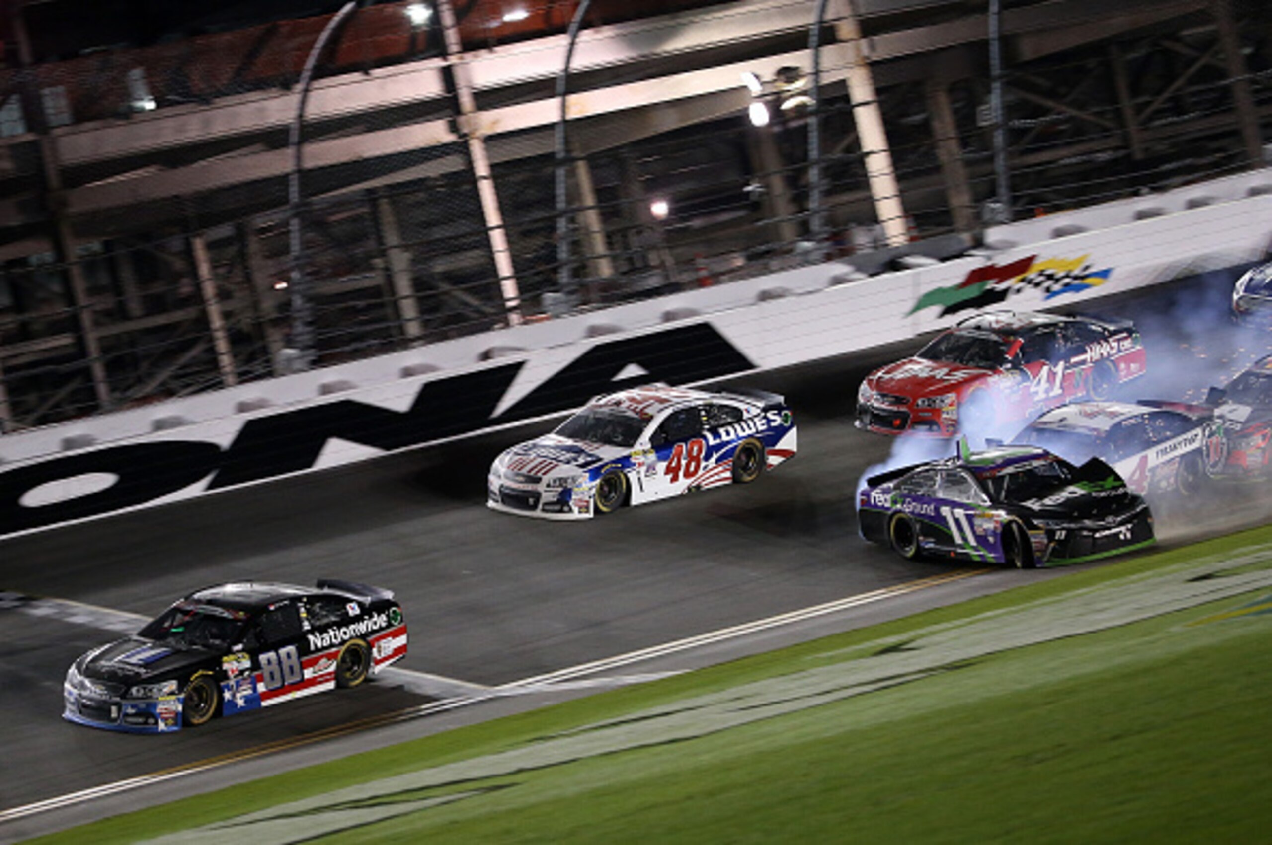 As Earnhardt Jr. crossed the Daytona finish line in his No. 88 Chevrolet , several cars started wrecking right behind him.