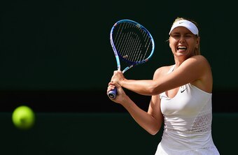 Maria Sharapova hits a backhand during her quarterfinal match at Wimbledon.