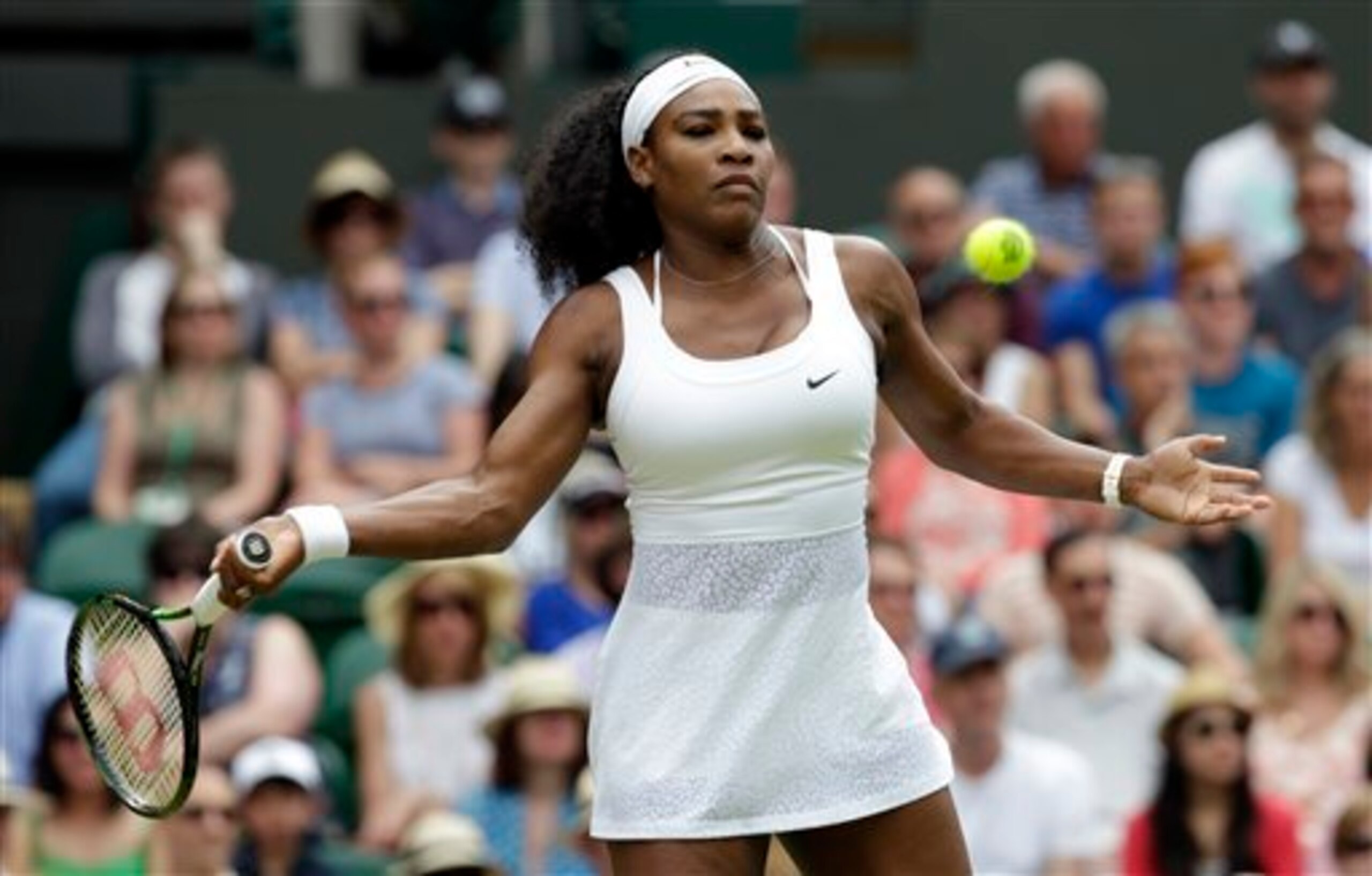 Serena Williams hits a forehand during a fourth-round match at Wimbledon.
