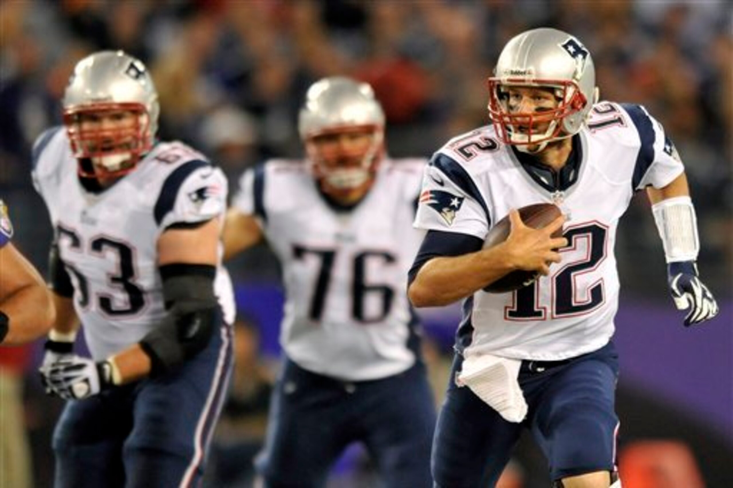 Dan Connolly (63, left), Sebastian Vollmer (76, middle) and Tom Brady (12, right) are at the center of the news cycle around the New England Patriots.