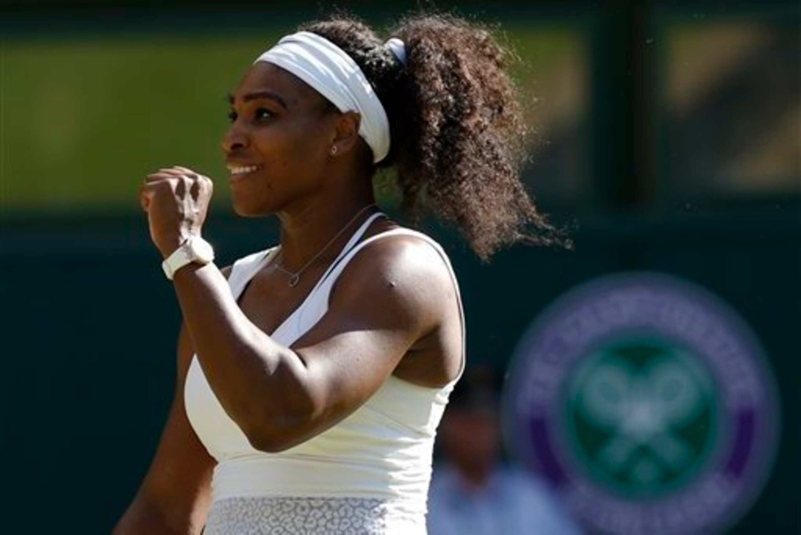 Serena Williams clinches fist to celebrate semifinals win over Maria Sharapova at Wimbledon. Serena Williams clinches fist to celebrate semifinals win over Maria Sharapova at Wimbledon.