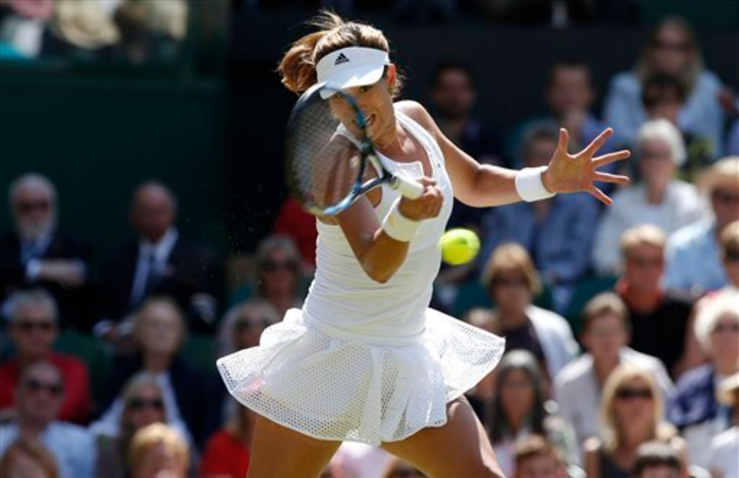 Garbine Muguruza hits a forehand during her semifinal match at Wimbledon. Garbine Muguruza hits a forehand during her semifinal match at Wimbledon.