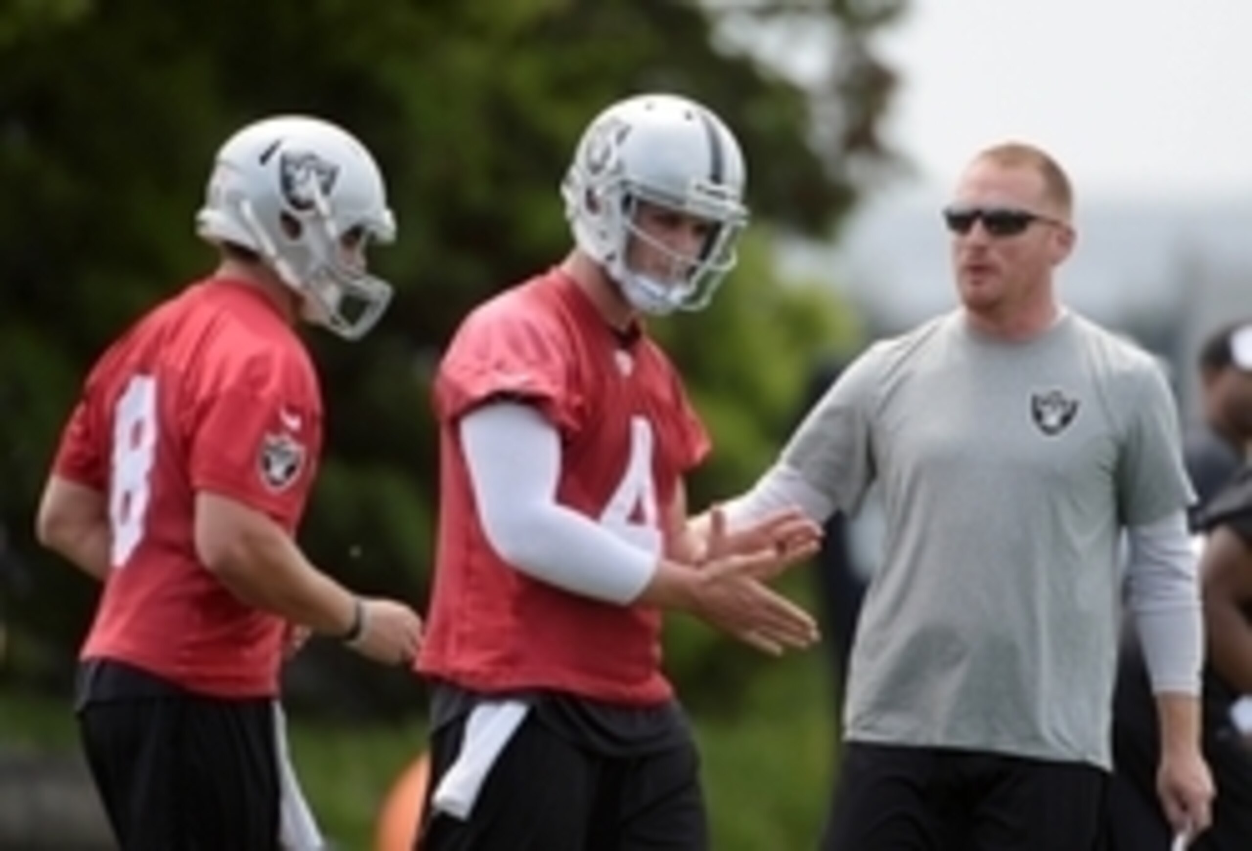 Cody Fajardo (left) Derek Carr (middle) Quarterbacks Coach Todd Downing (right)