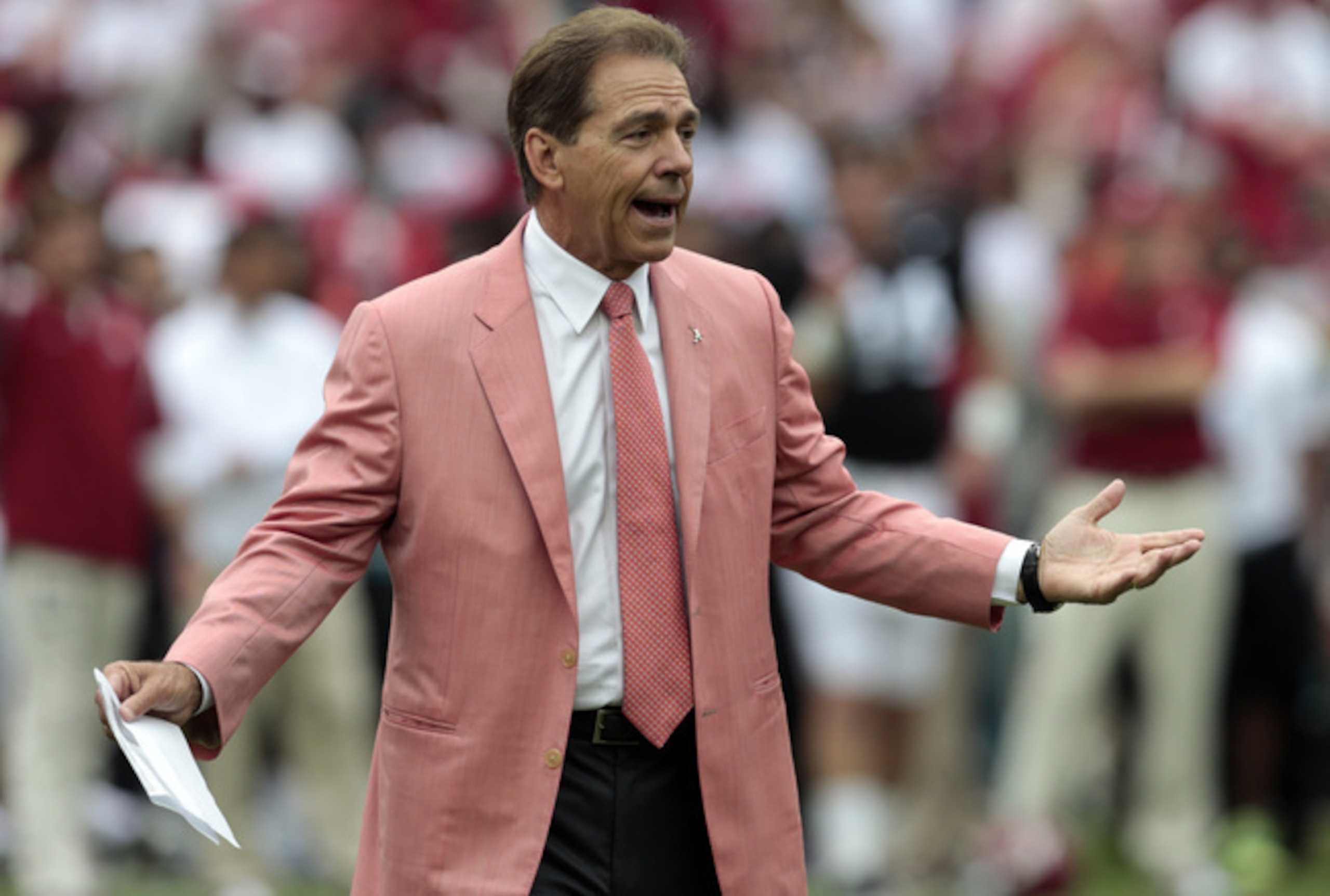 Saban rocking the salmon colored suit. Saban rocking the salmon colored suit.