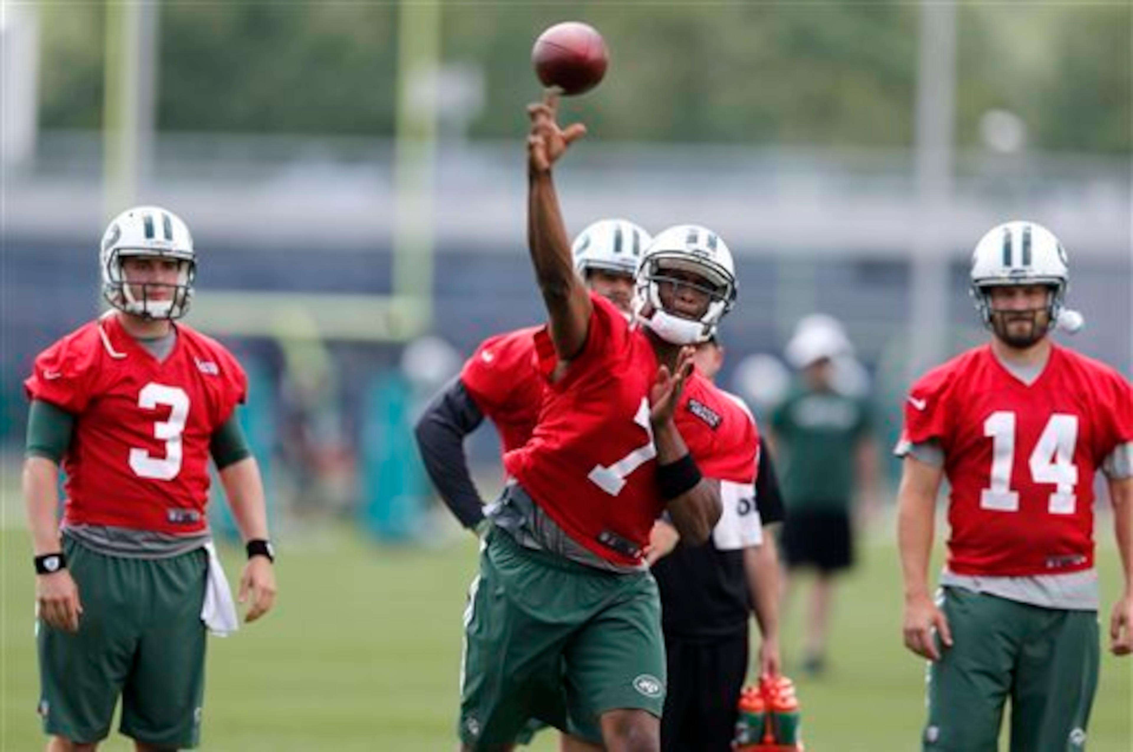 Geno Smith (7, middle) and Ryan Fitzpatrick (14, right) will be battling it out for the starting quarterback job...kind of. Geno Smith (7, middle) and Ryan Fitzpatrick (14, right) will be battling it out for the starting quarterback job...kind of.