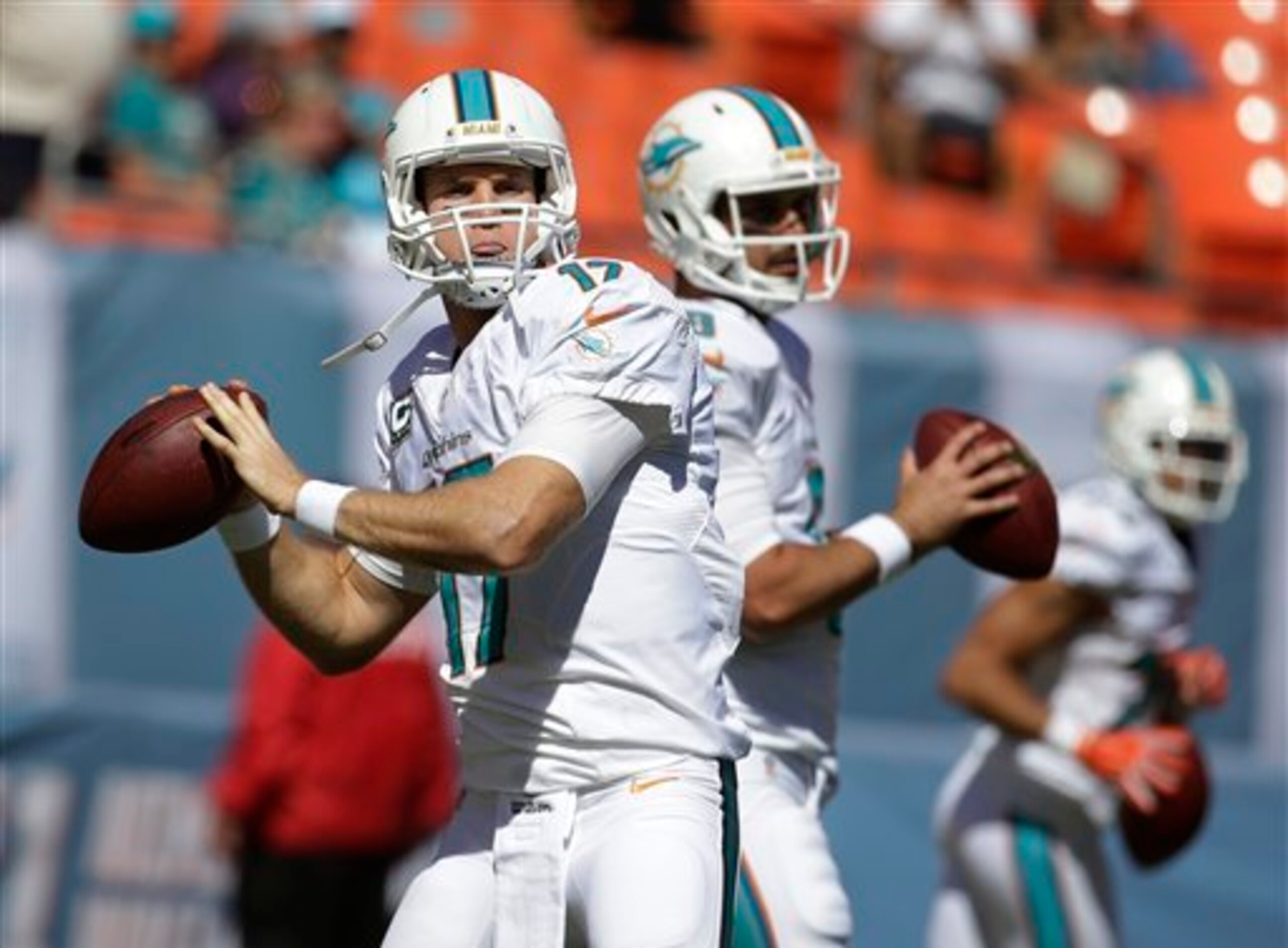 Ryan Tannehill (17, left) has a very capable backup behind him in Matt Moore (8, right).