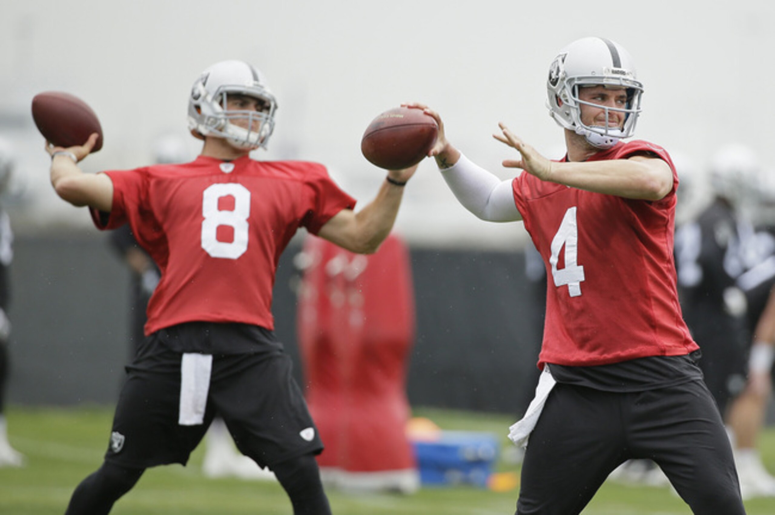 Cody Fajardo (left) and Derek Carr (right).