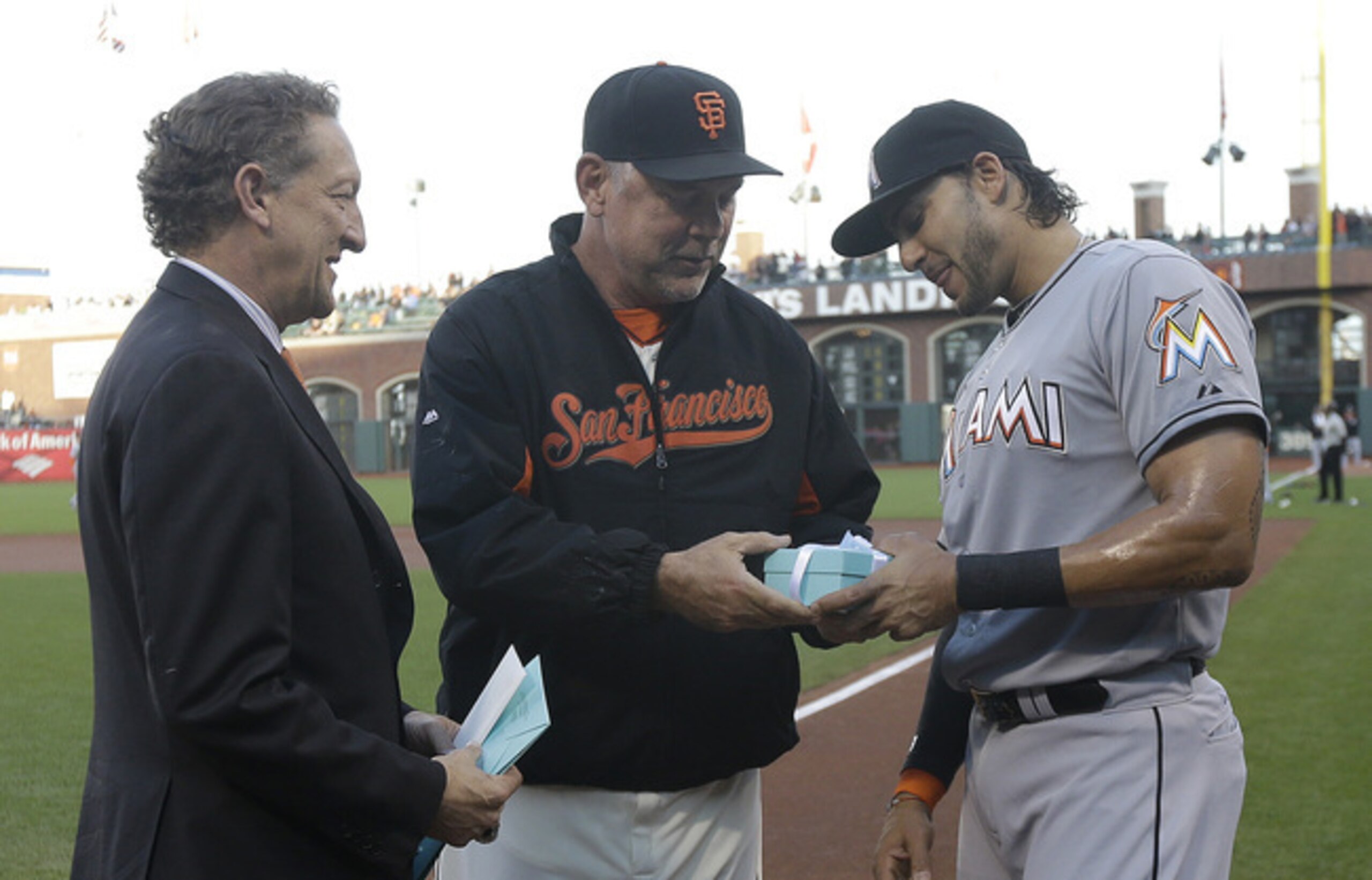 Michael Morse (far right) receives his World Series ring from his former manager, Bruce Bochy.