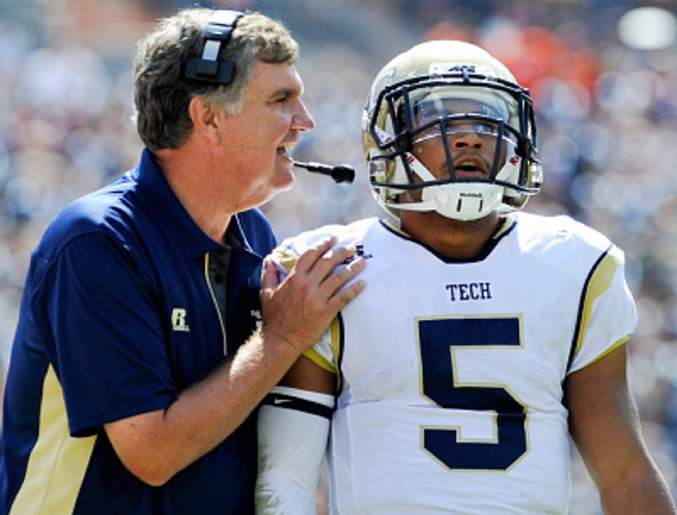 BLACKSBURG, VA - SEPTEMBER 20: Head coach Paul Johnson gives instruction to quarterback Justin Thomas #5 of the Georgia Tech Yellow Jackets in the first half against Virginia Tech at Lane Stadium on September 20, 2014 in Blacksburg, Virginia. Georgia Te BLACKSBURG, VA - SEPTEMBER 20: Head coach Paul Johnson gives instruction to quarterback Justin Thomas #5 of the Georgia Tech Yellow Jackets in the first half against Virginia Tech at Lane Stadium on September 20, 2014 in Blacksburg, Virginia. Georgia Te