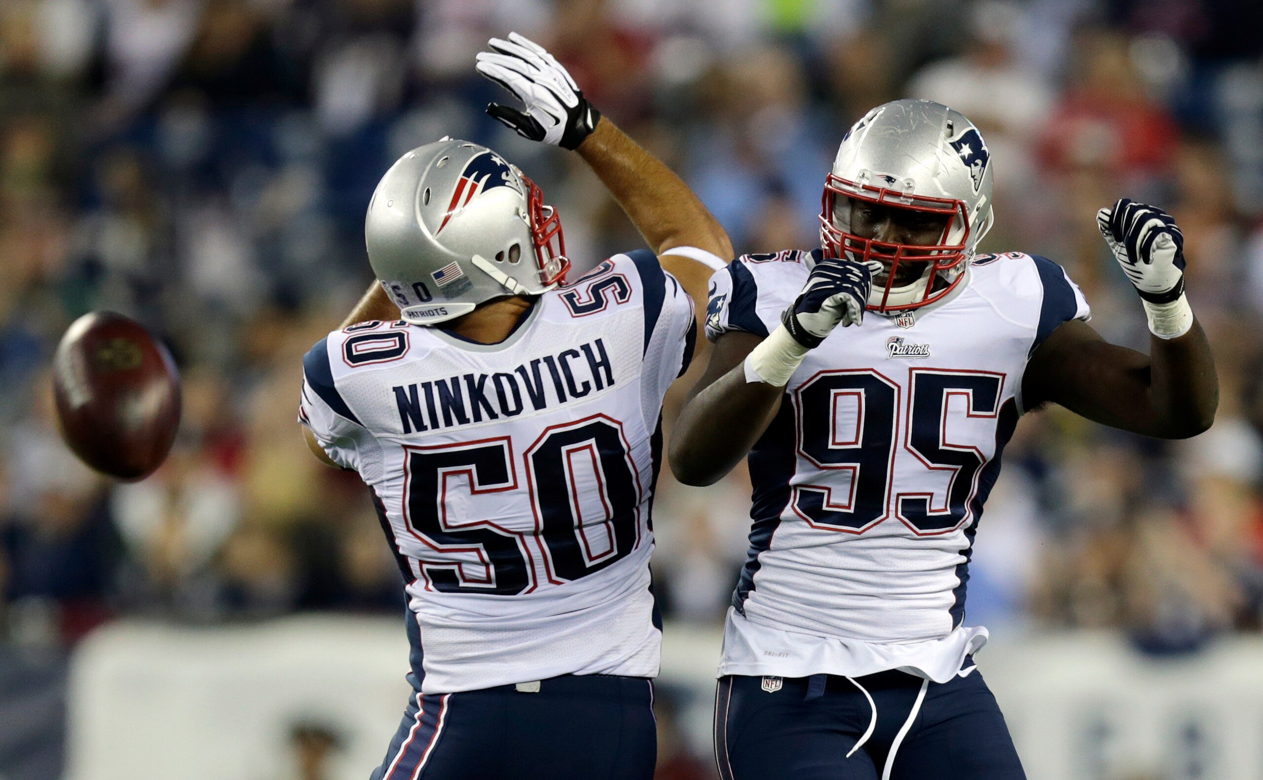 Defensive ends Rob Ninkovich (50, left) and Chandler Jones (95, right) will probably be the starting defensive ends for the Patriots in 2015. But Ninkovich may be fighting for his job.
