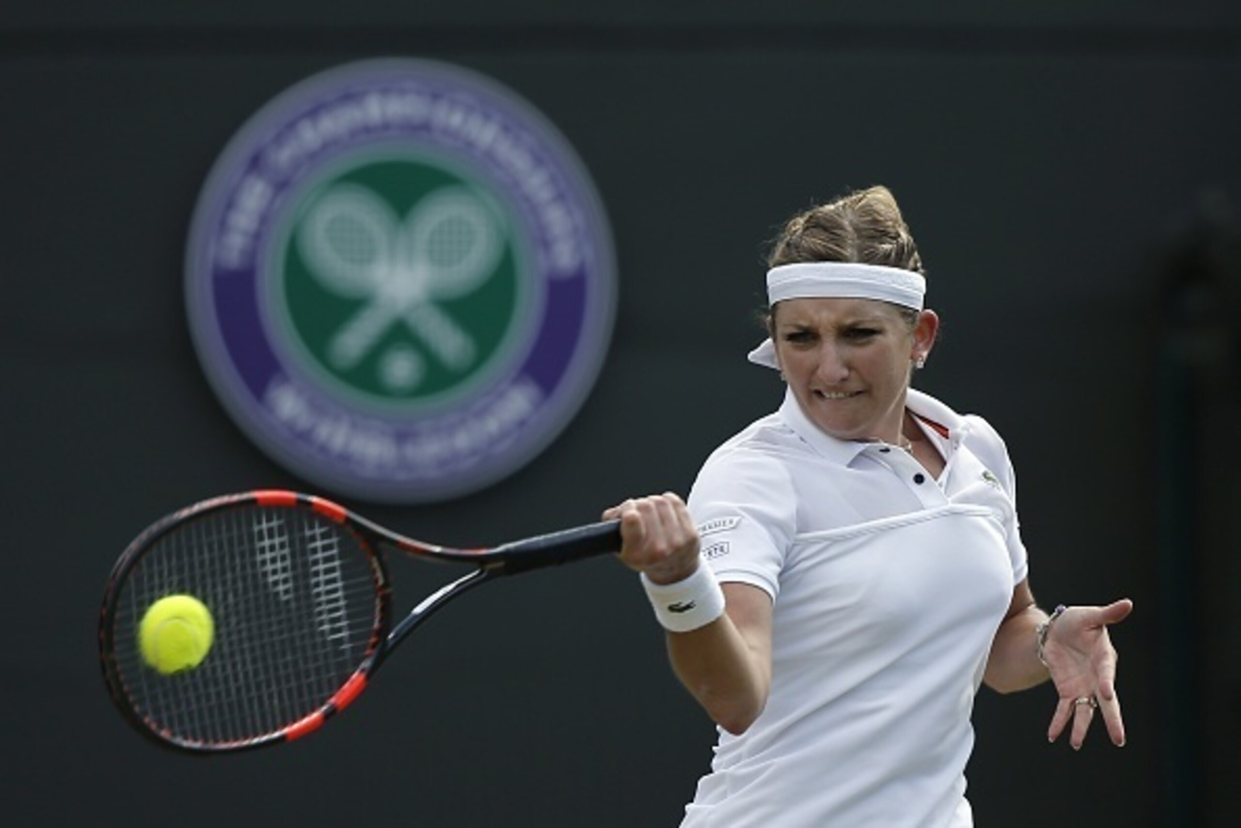 Switzerland's Timea Bacsinszky returns against Spain's Garbine Muguruza during their women's quarter-final match on day eight of the 2015 Wimbledon Championships at The All England Tennis Club in Wimbledon, southwest London, on July 7, 2015.   RESTRICTED 