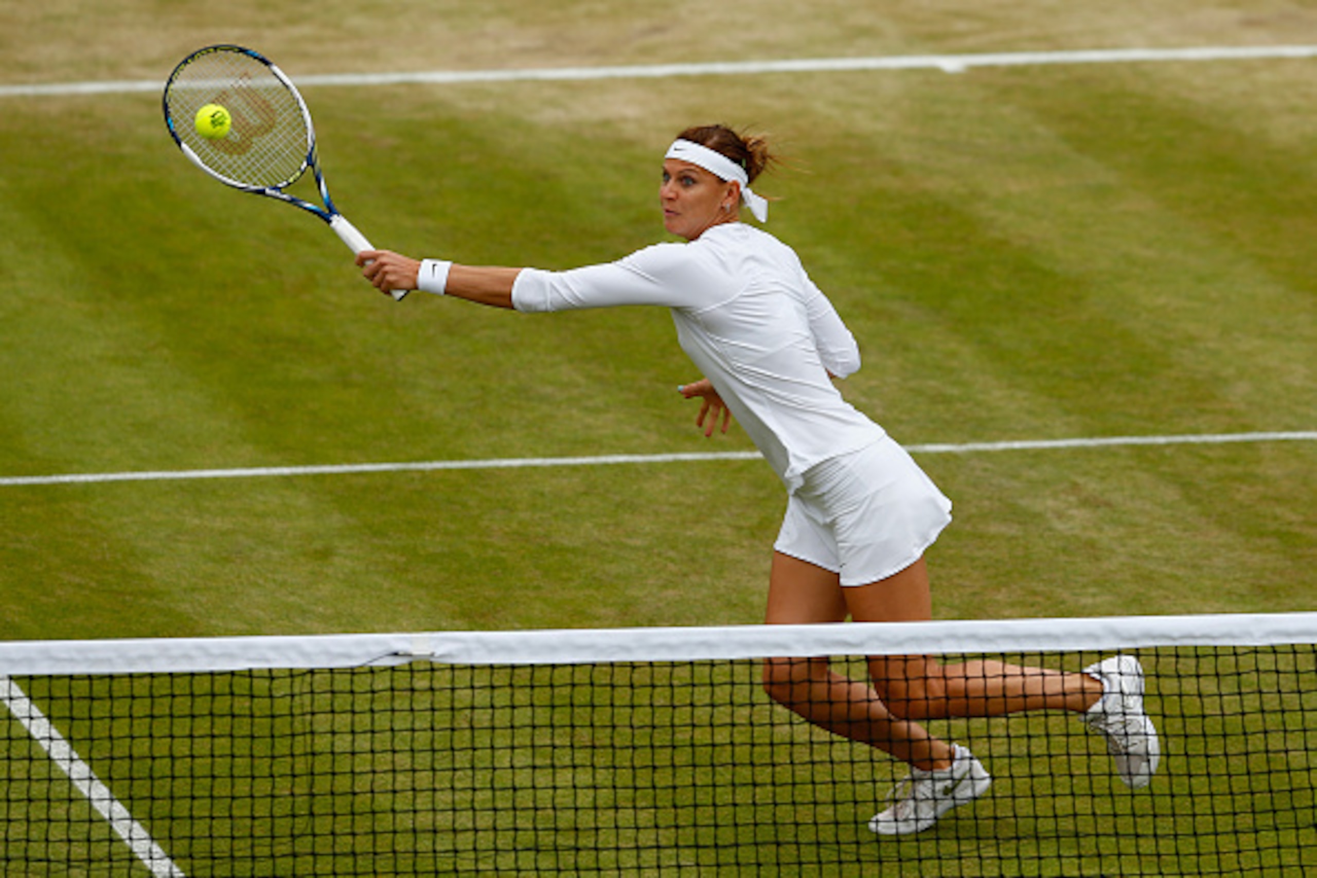 LONDON, ENGLAND - JULY 08:   Lucie Safarova of the Czech Republic playing with Bethanie Mattek-Sands of the United States in action in the Ladies' Doubles Quarter Final match against Raquel Kops-Jones (L) of the United States and Abigail Spears of the Uni