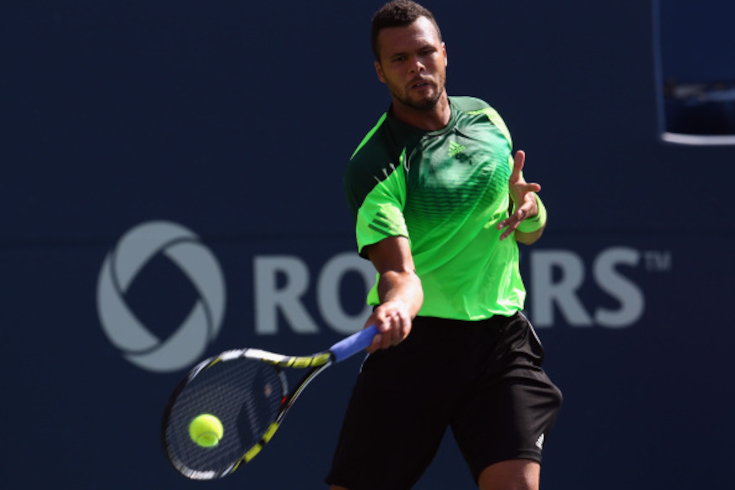 Jo-Wilfried Tsonga hits a forehand at 2014 Rogers Cup.