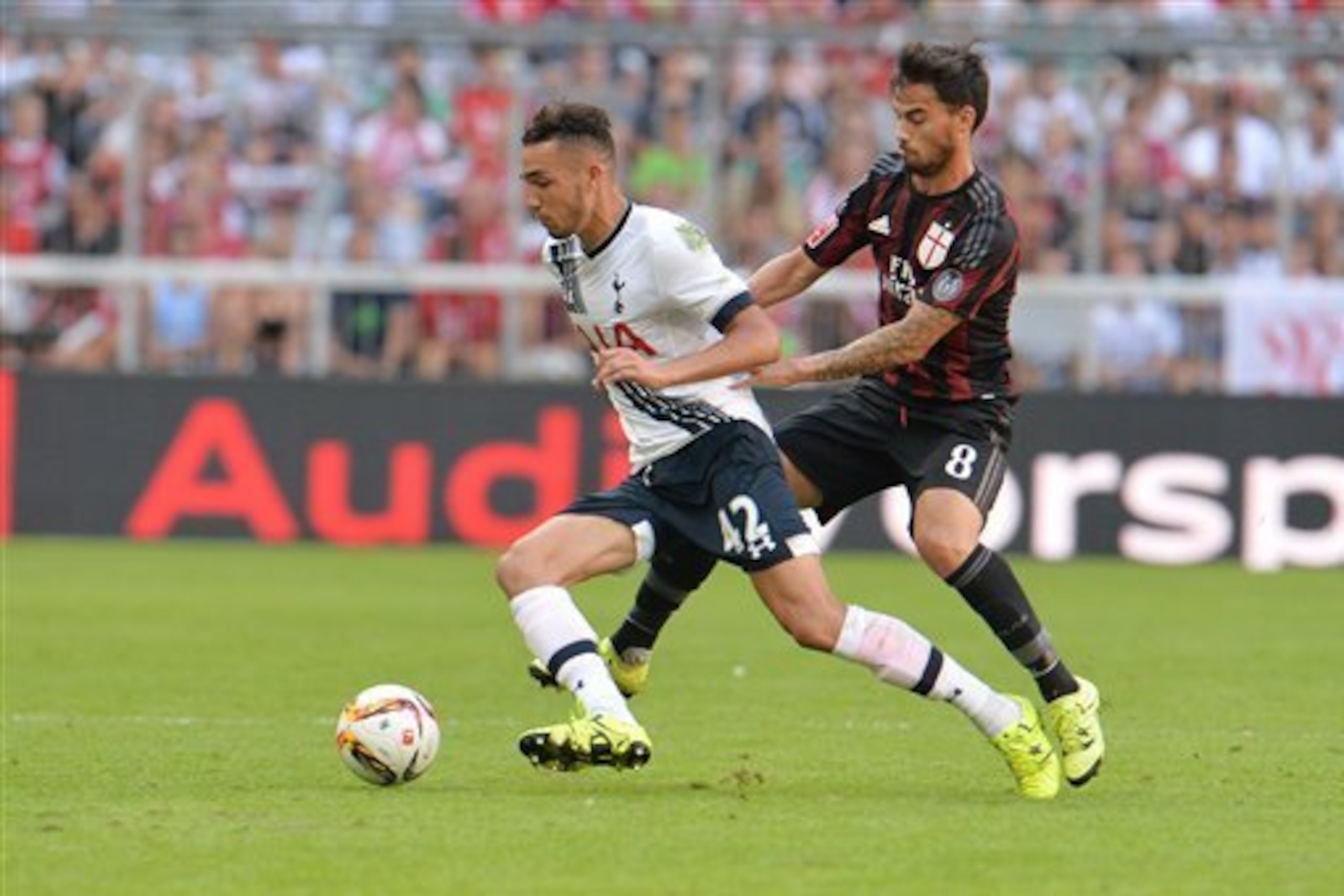 Tottenham Hotspur held off AC Milan in the Allianz Arena to confirm third place in the Audi Cup.