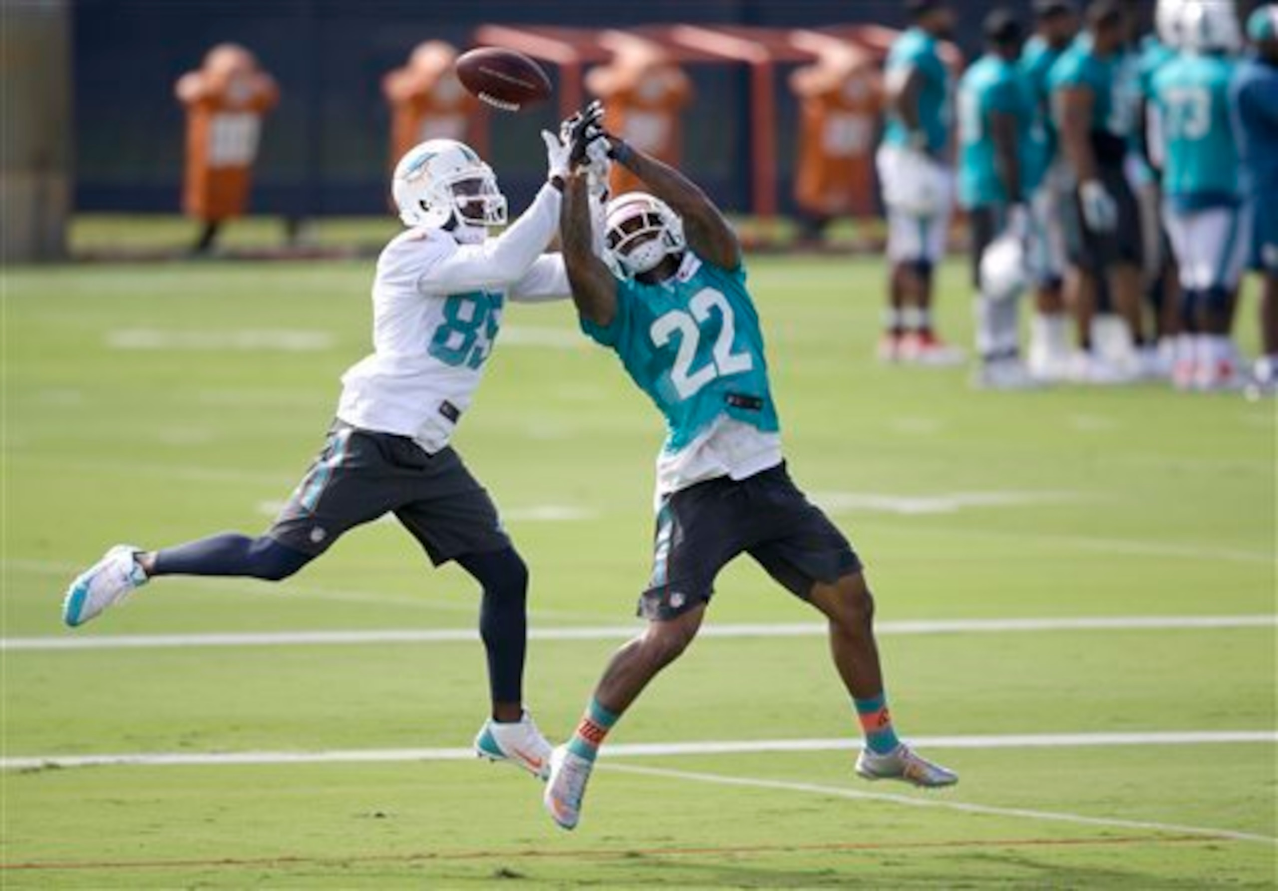 Jamar Taylor (22, right) has been making his presence felt at Dolphins practice all summer to this point.