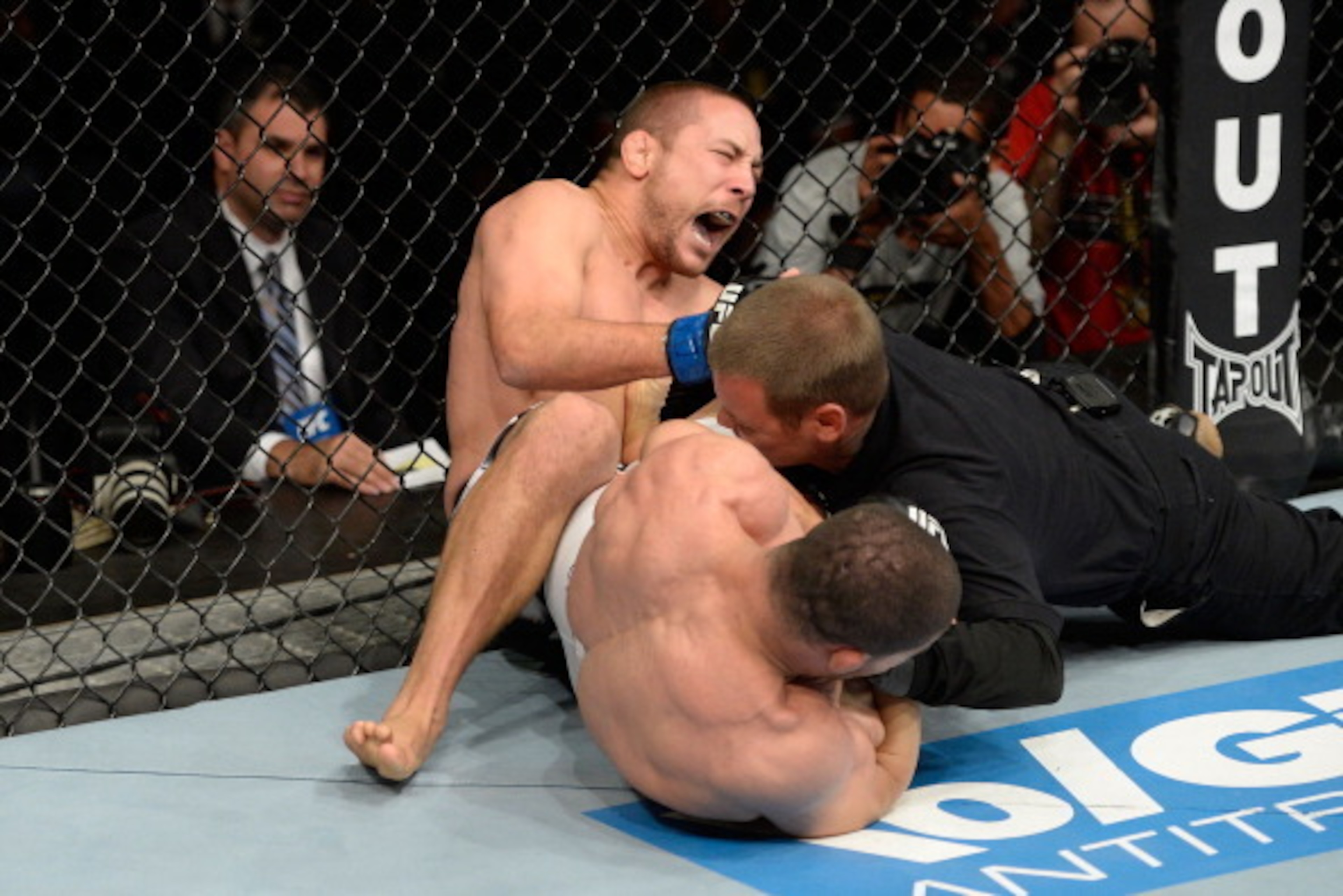 Rousimar Palhares (bottom) injured Mike Pierce with a leg lock in 2013.