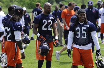 Backup running backs Senorise Perry (left) and Jacquizz Rodgers (35) are two of five running backs competing to be Matt Forte's (22) backup.