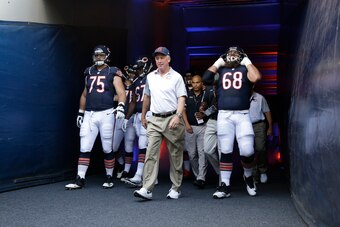 Kyle Long (75) and Matt Slauson (68) will be two of the anchor's along Chicago's offensive line this season for head coach John Fox (center).